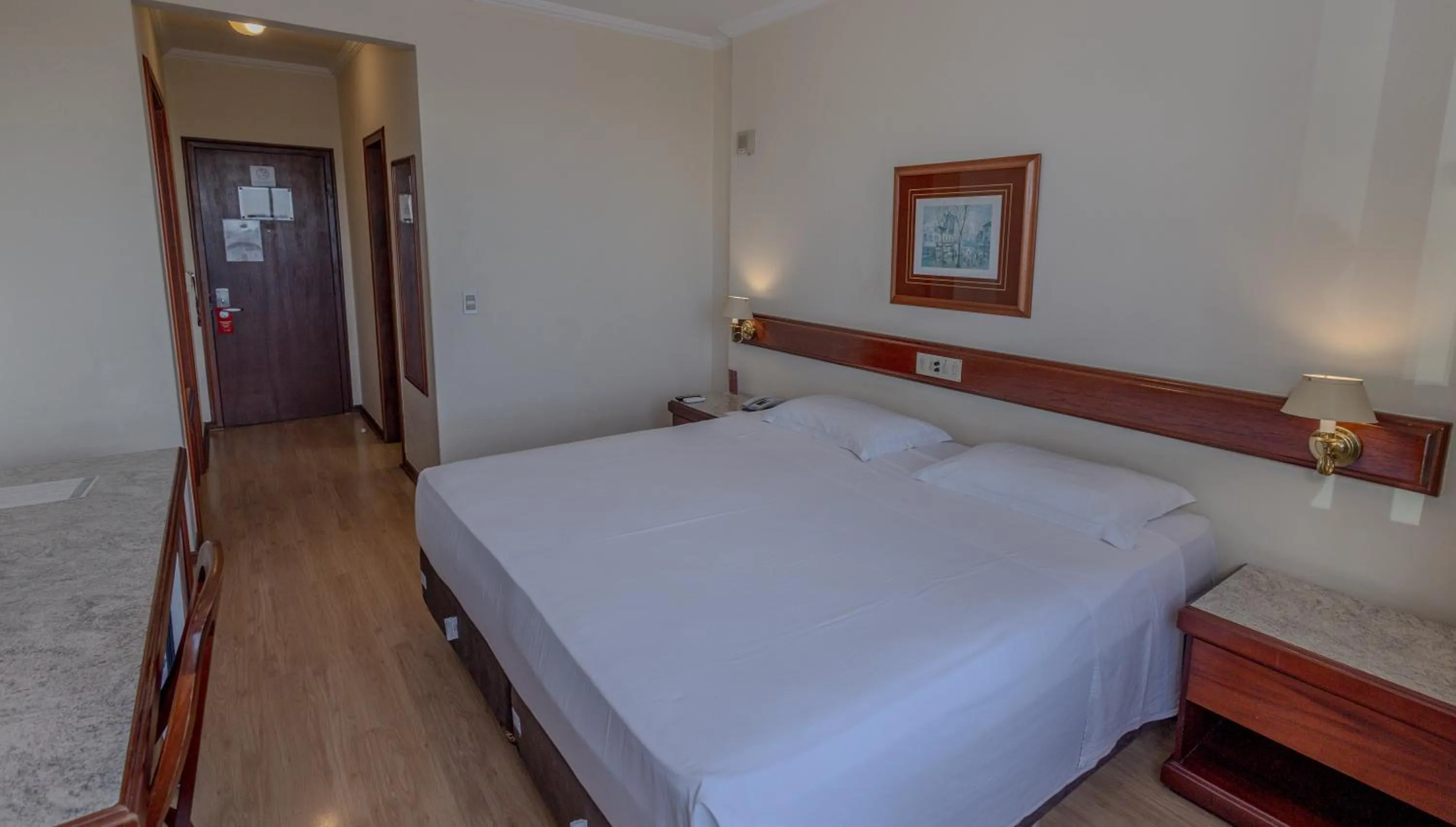 Bed in Lizon Curitiba Hotel