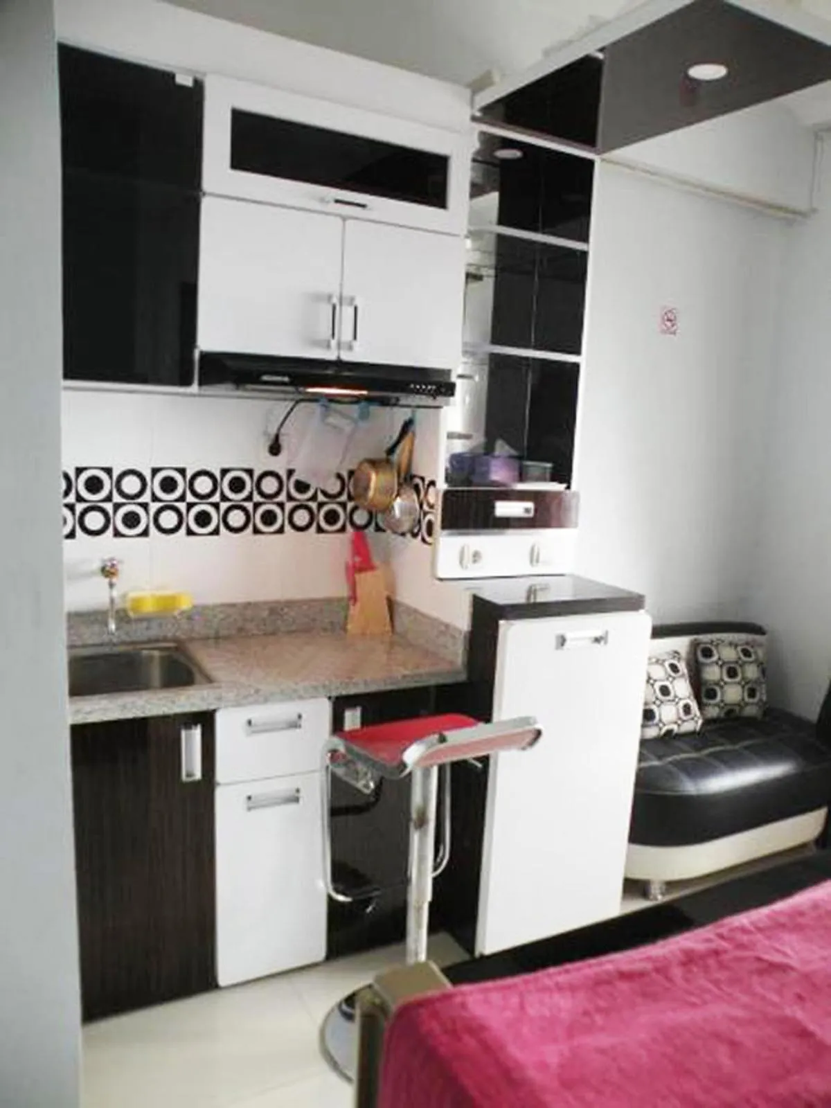 Kitchen or kitchenette in Apartment Green Pramuka ~ OCR