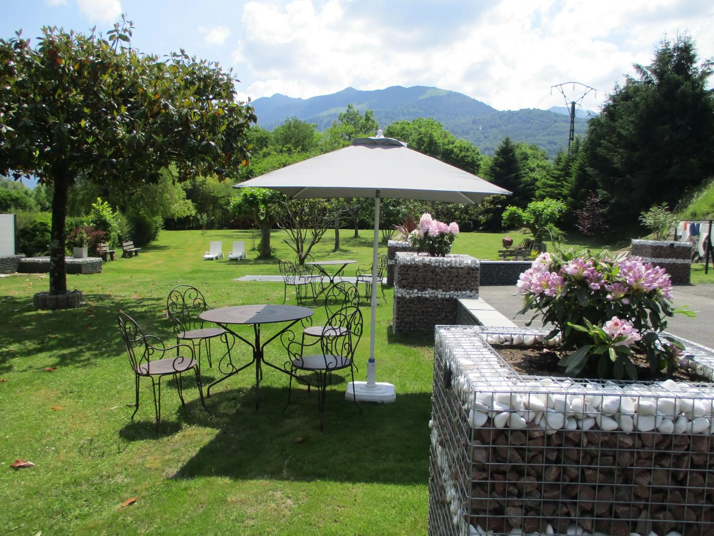 Garden in Logis Hôtel L'Ayguelade