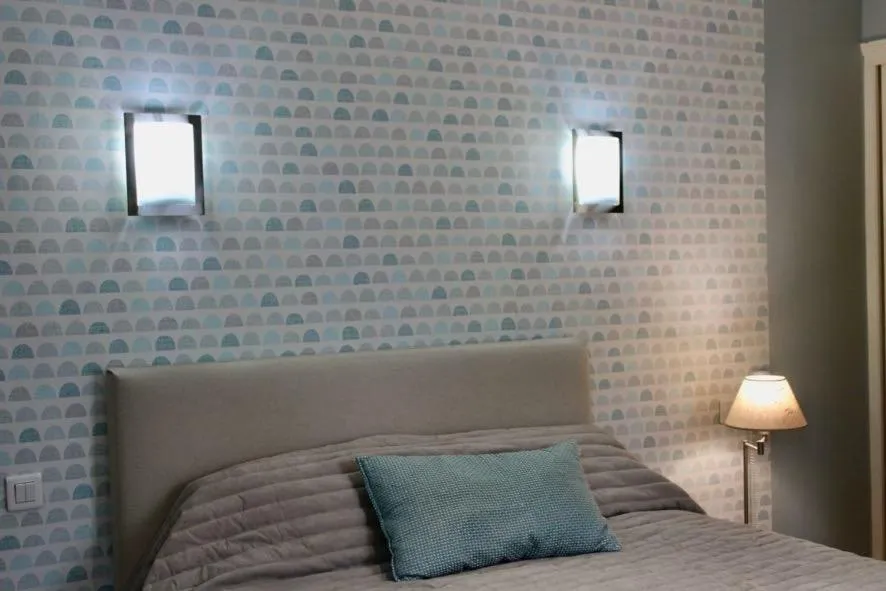 Bed in Logis Hôtel L'Ayguelade