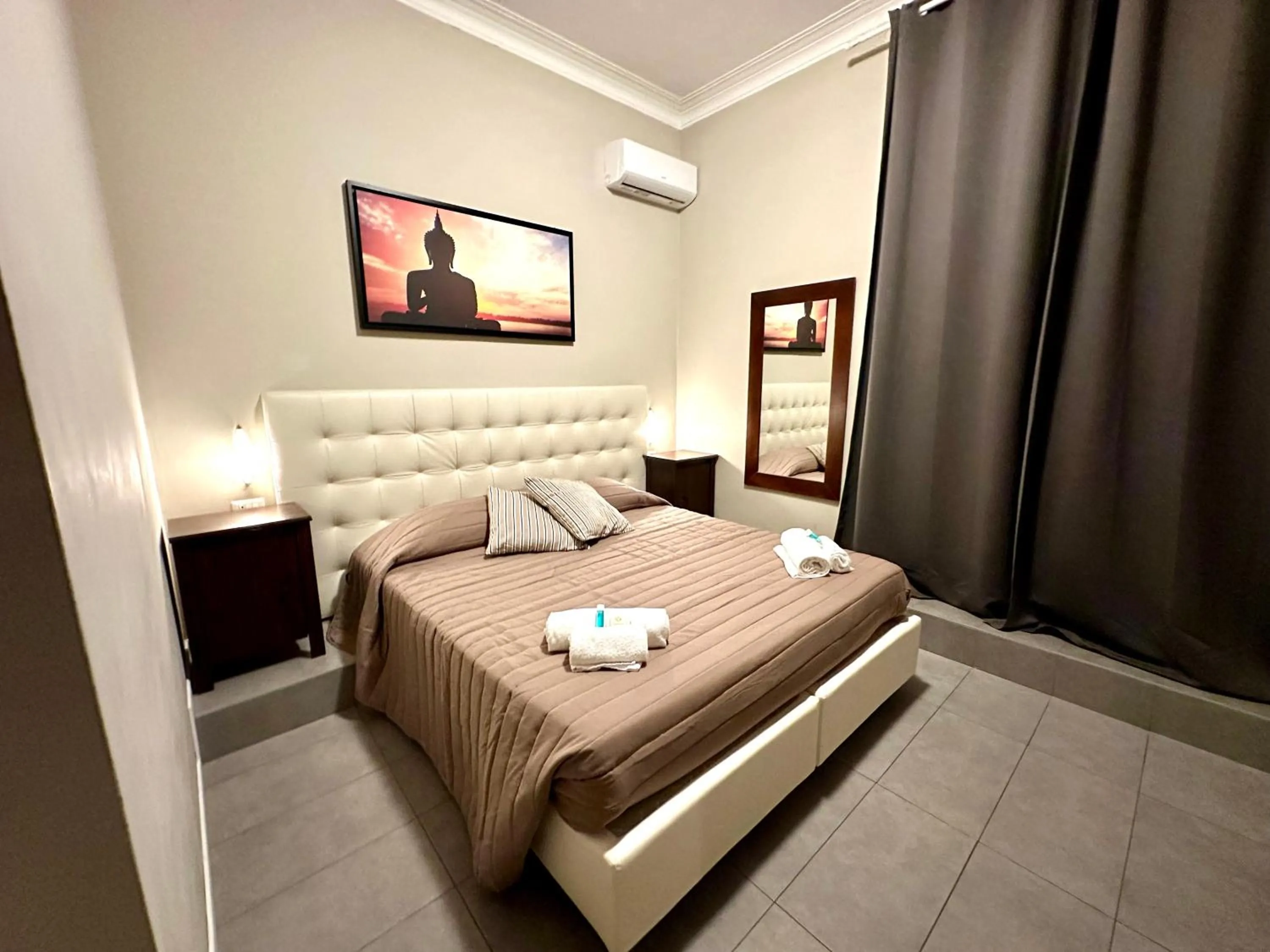 Bed in Carlo Goldoni Hotel