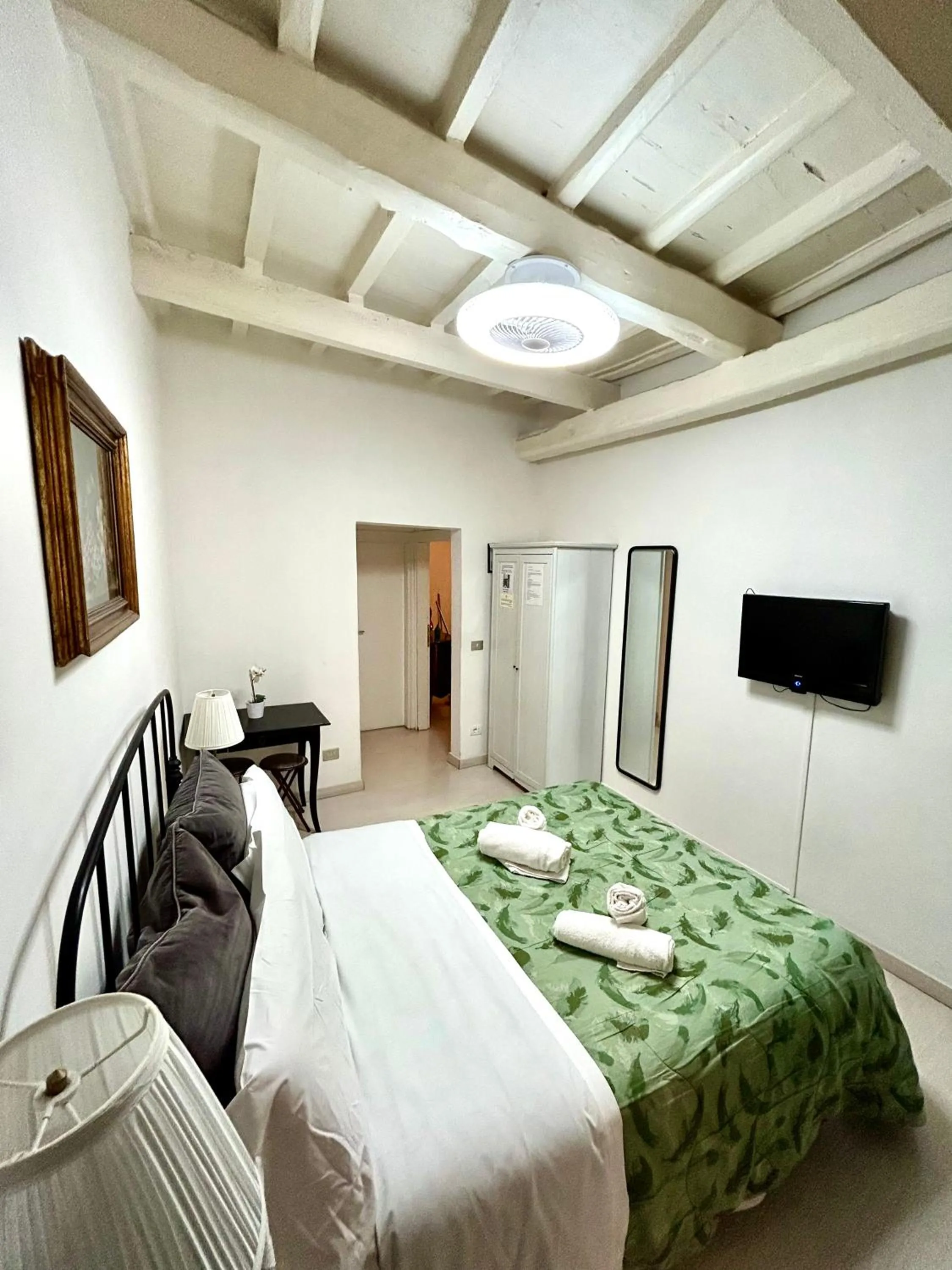 Bed in Gattopardo Rooms Florence