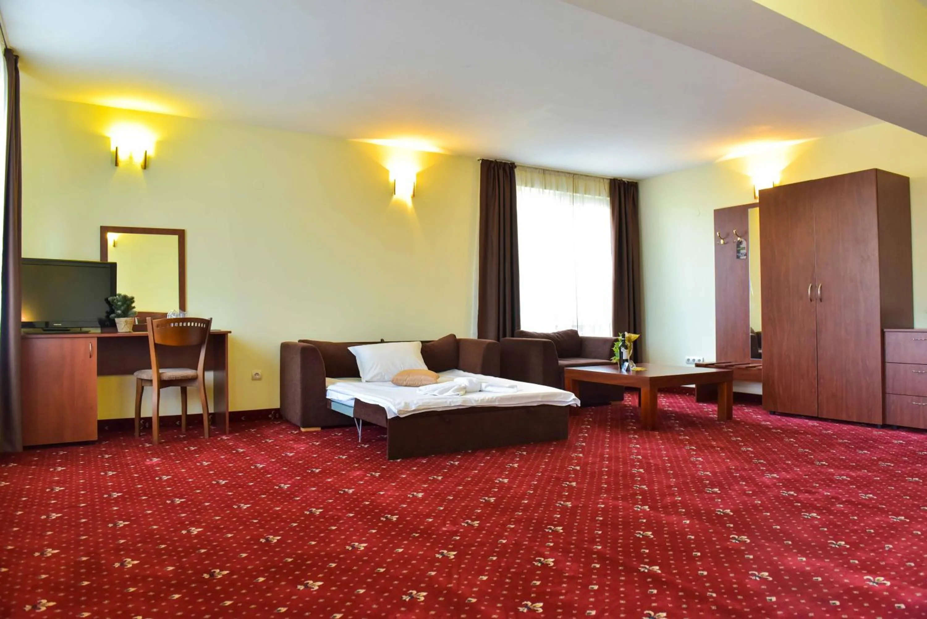 Communal lounge/ TV room, Bed in Hotel Bojur & Bojurland Apartment Complex