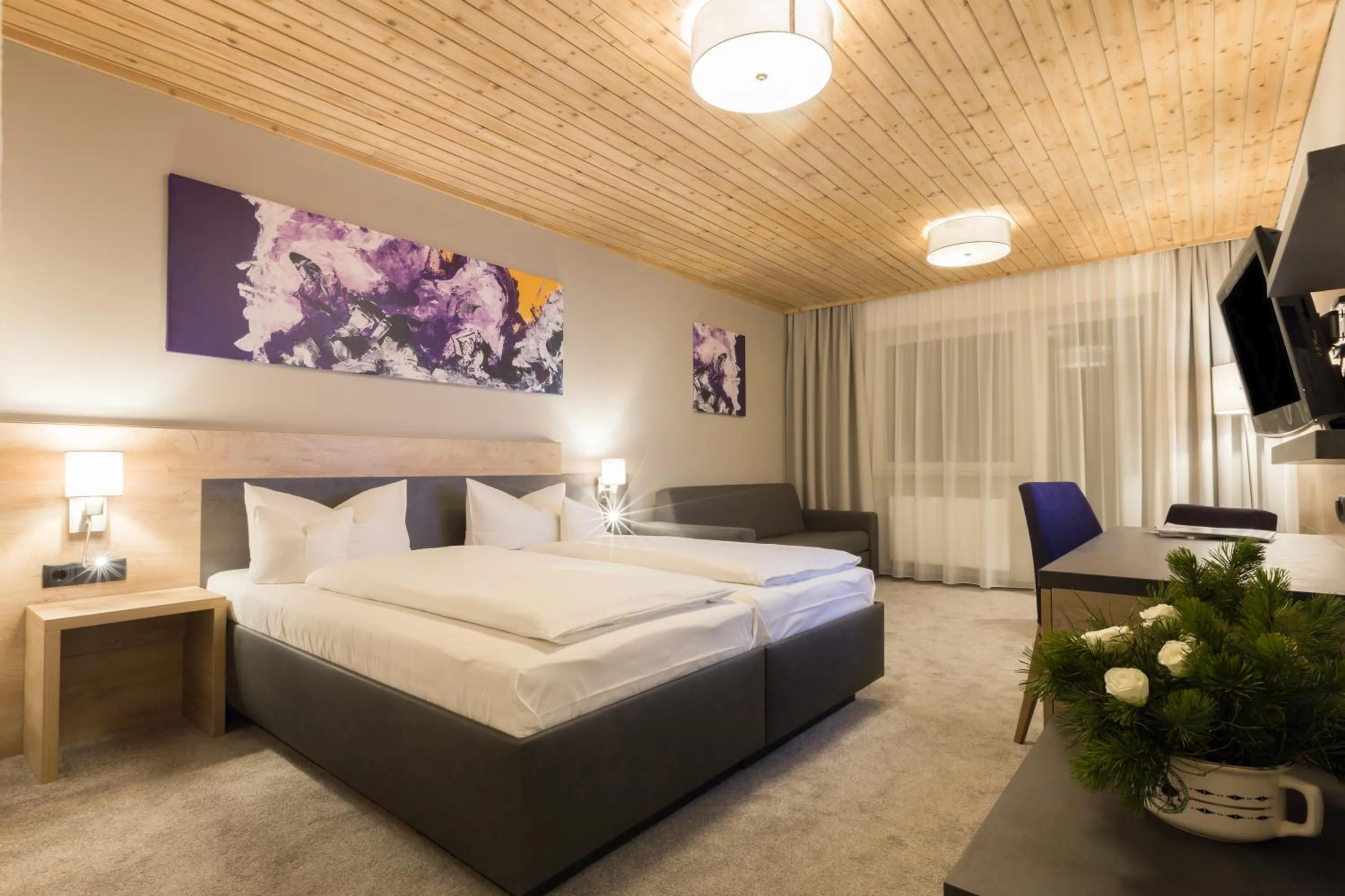 Bed in KOSIS Sports Lifestyle Hotel