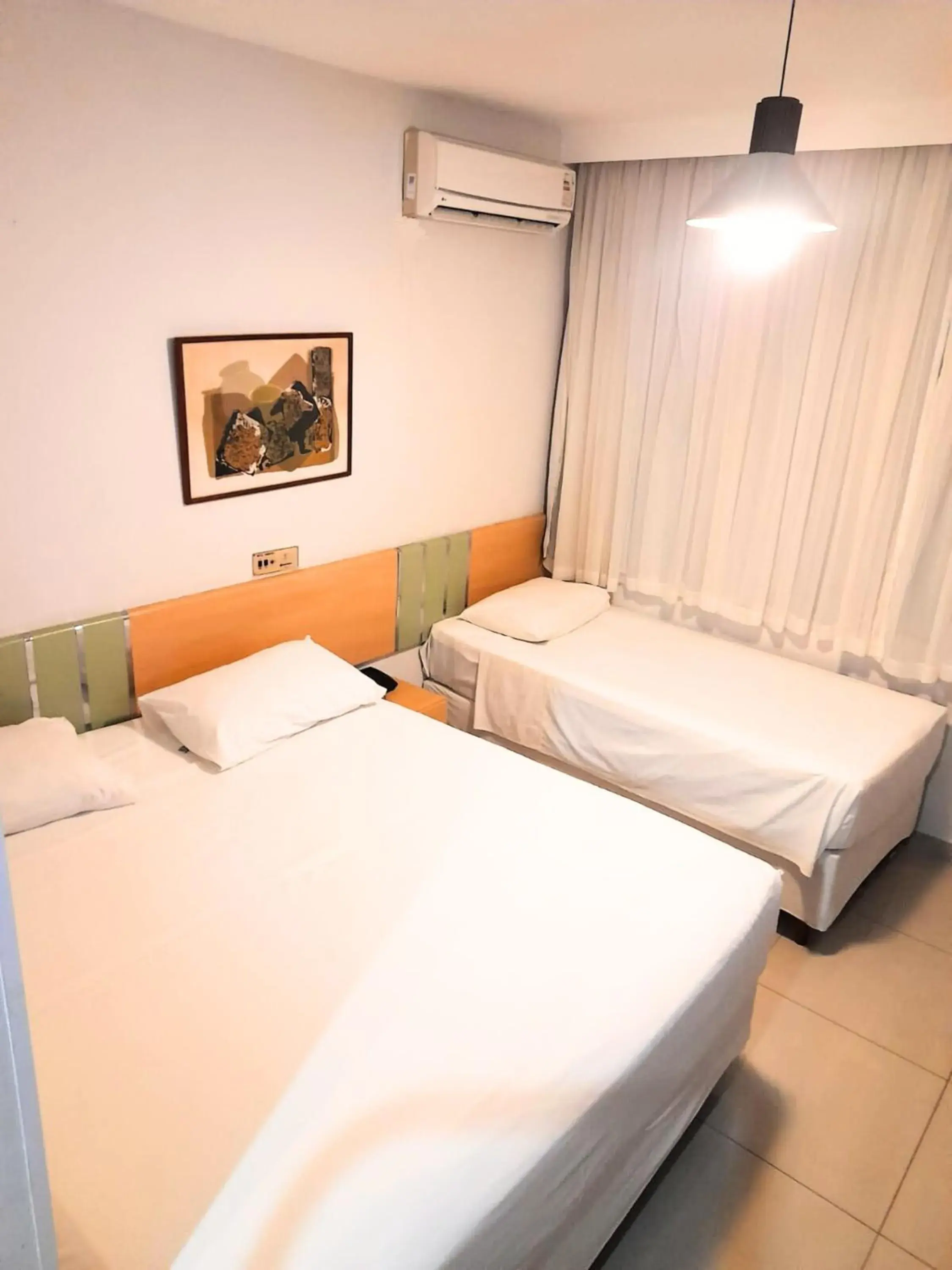 Deluxe Triple Room - single occupancy in Sumatra Hotel e Centro de Convenções Deluxe Triple Room - single occupancy in Sumatra Hotel e Centro de Convenções