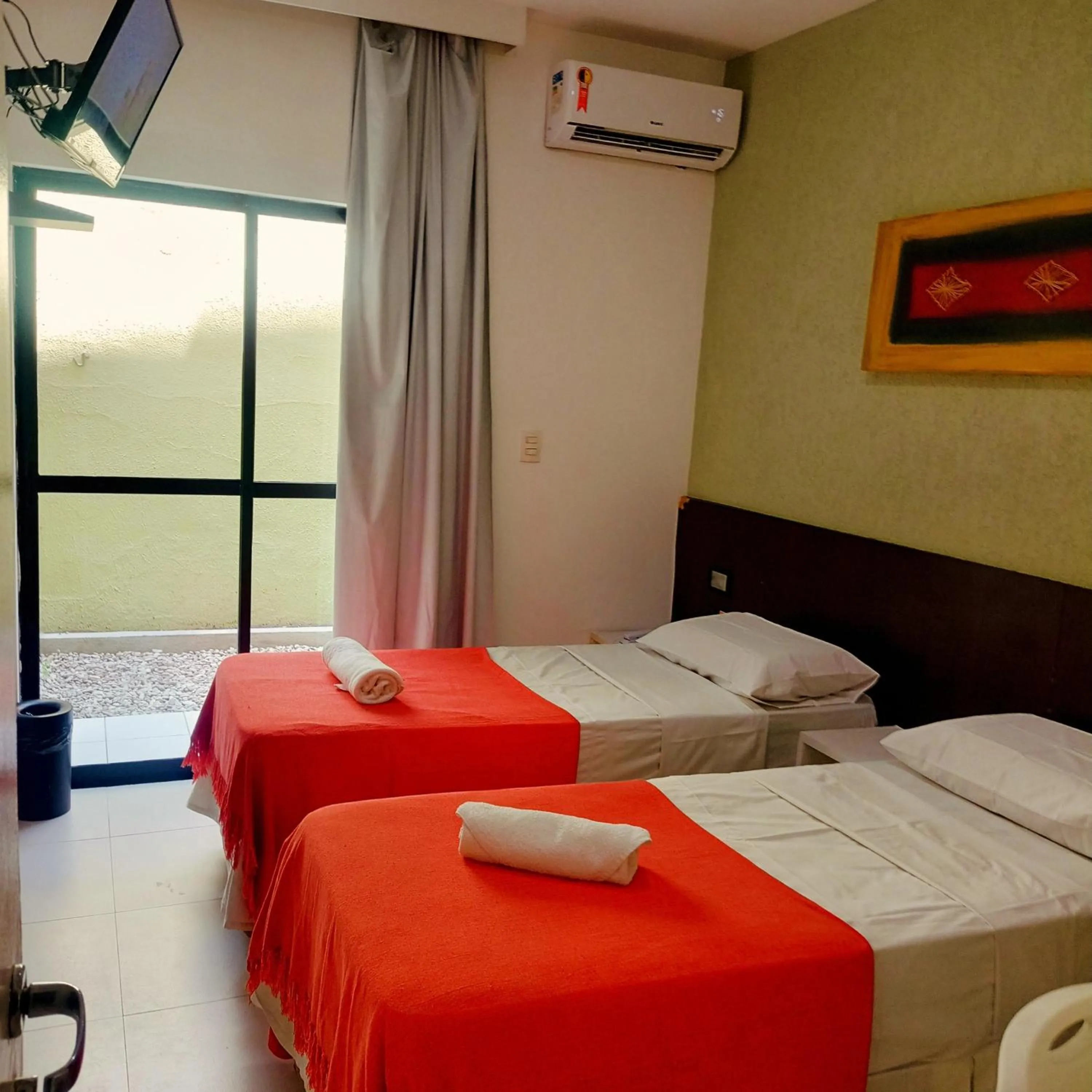 Bed in Pousada Aquarela Do Brasil