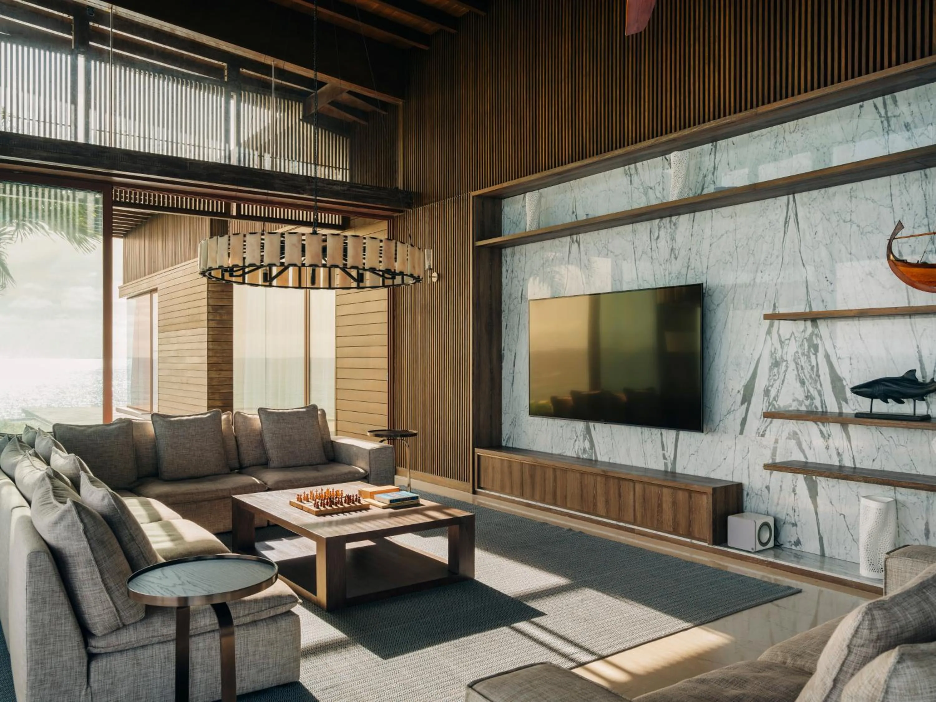 Communal lounge/ TV room in Park Hyatt Maldives Hadahaa