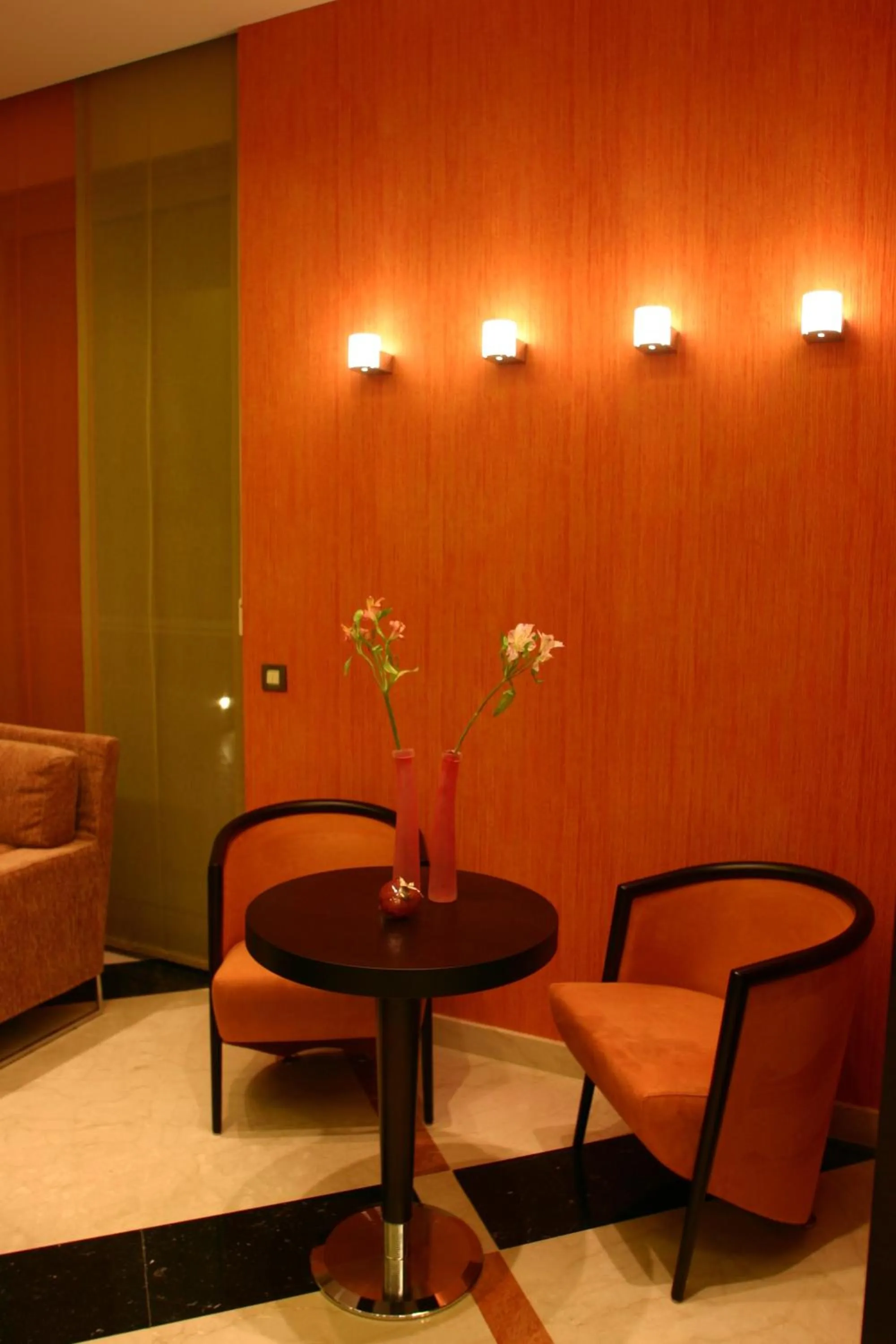 Communal lounge/ TV room in Alexandros Boutique Hotel