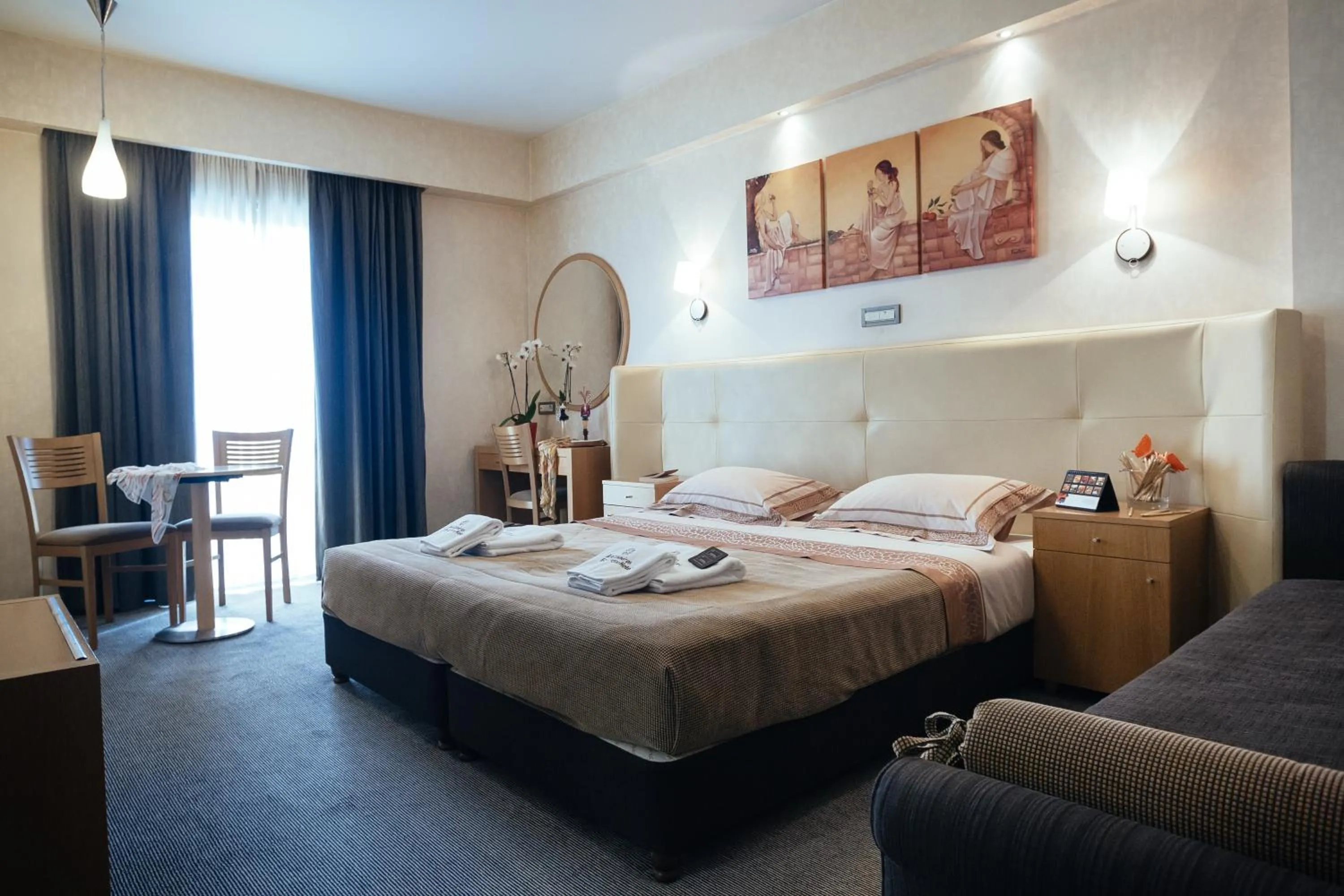 Seating area, Bed in Alexandros Boutique Hotel