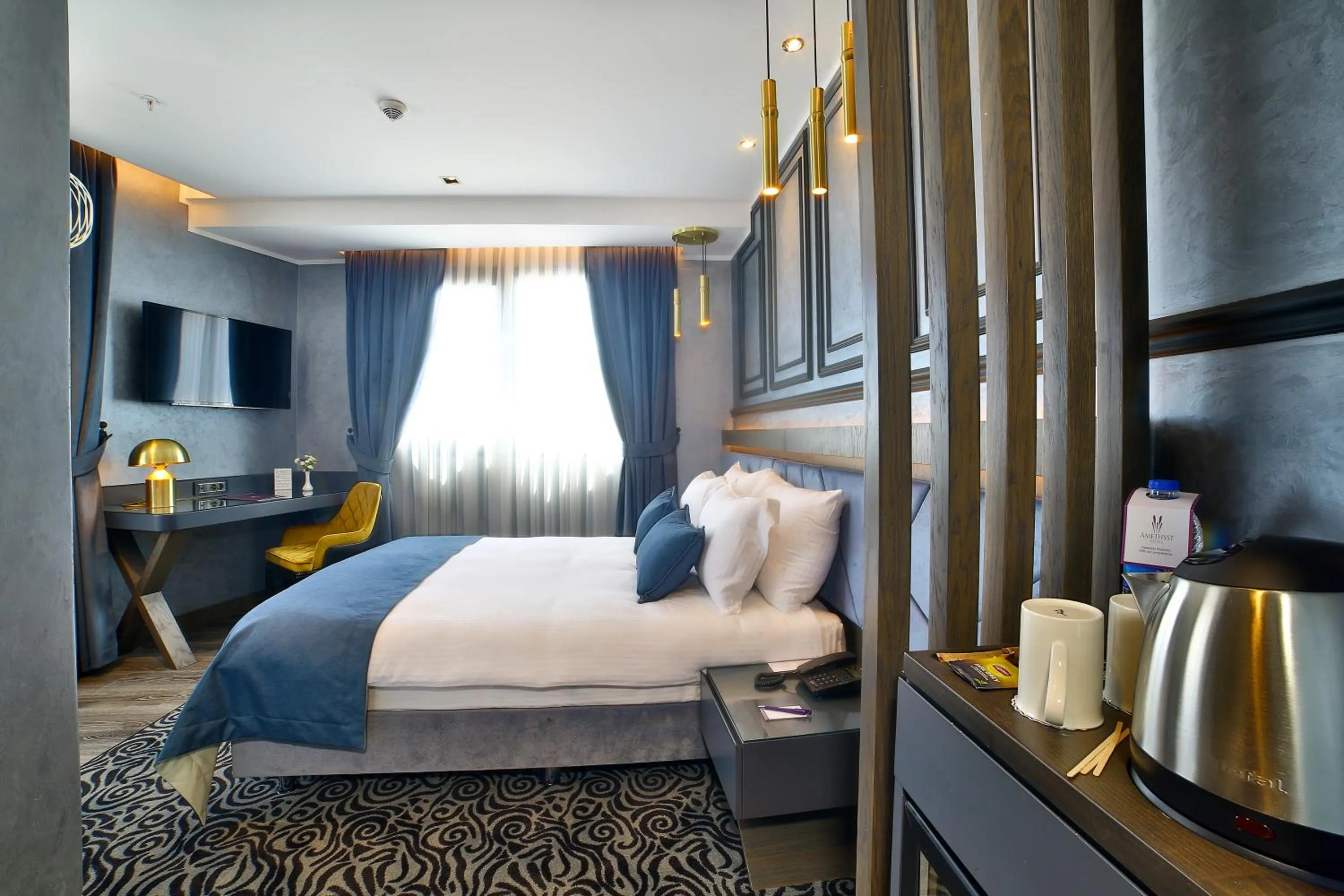 Bed in Amethyst Hotel