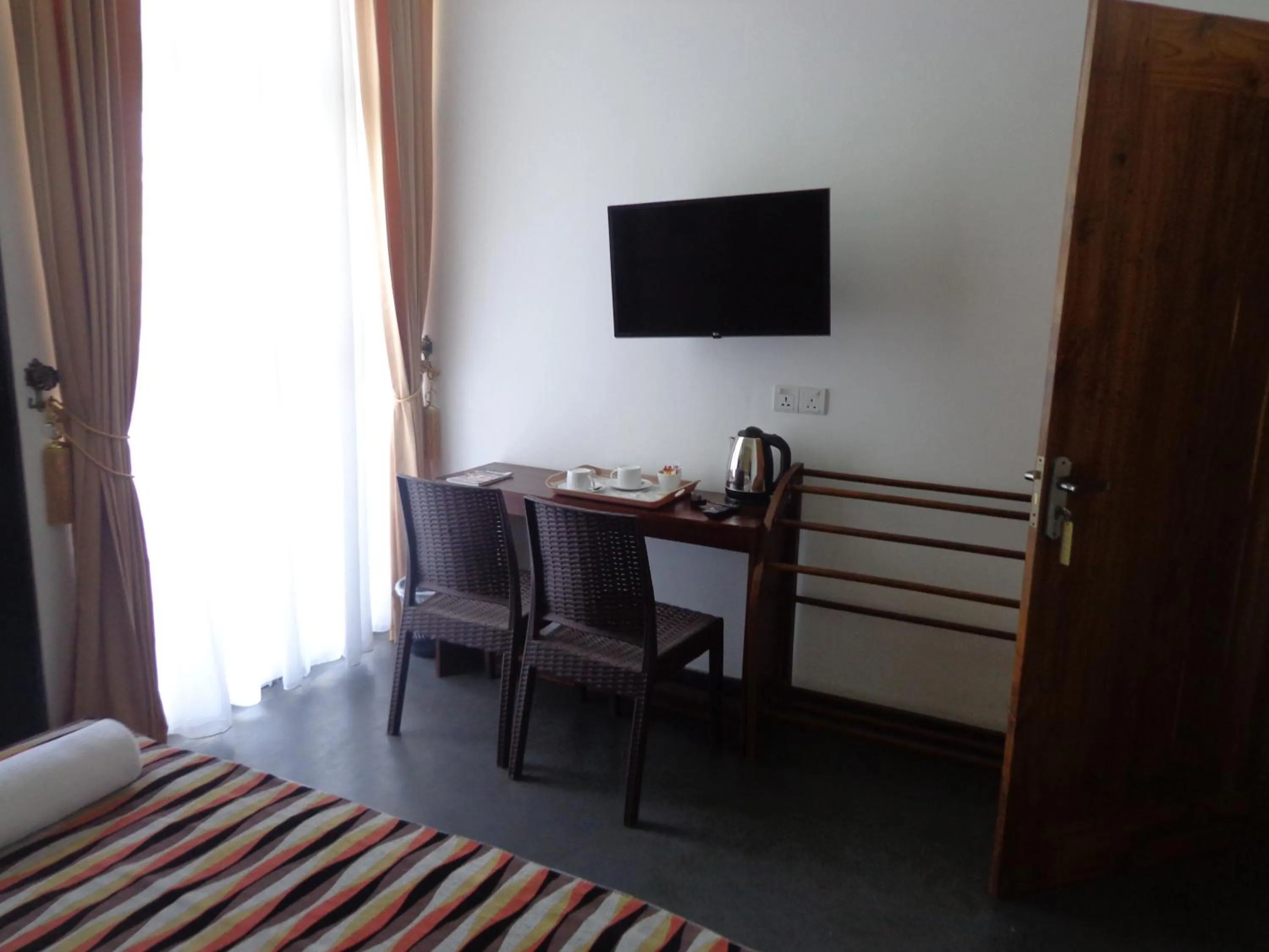 Communal lounge/ TV room, Bed in Hotel Star White - Negombo