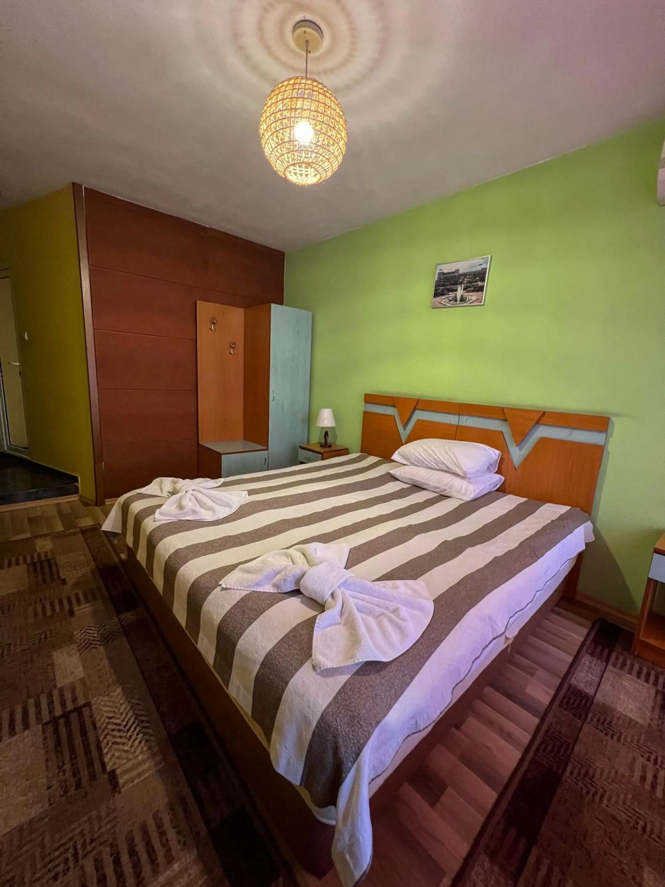 Bed in ALPHA family HOTEL