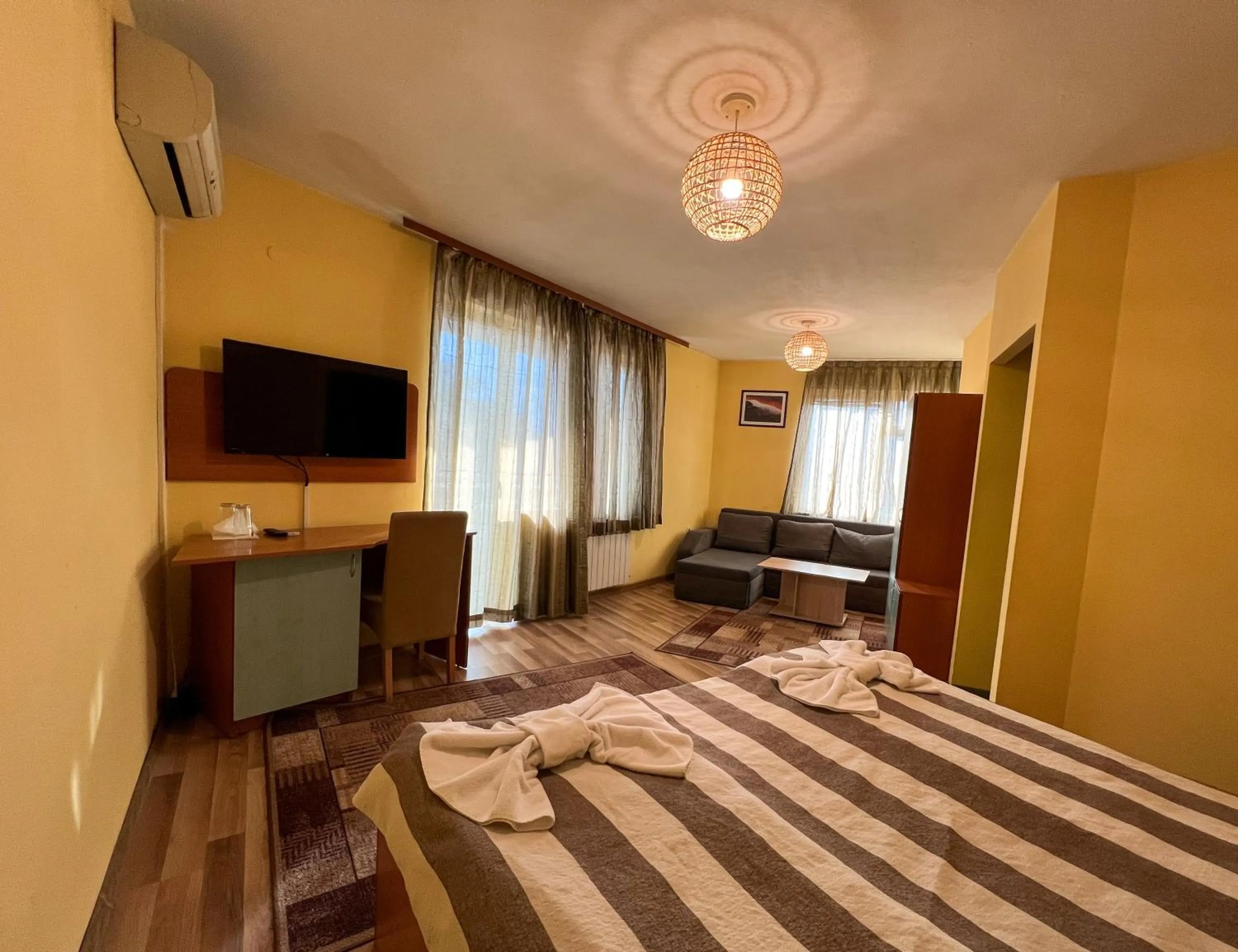 Bed in ALPHA family HOTEL