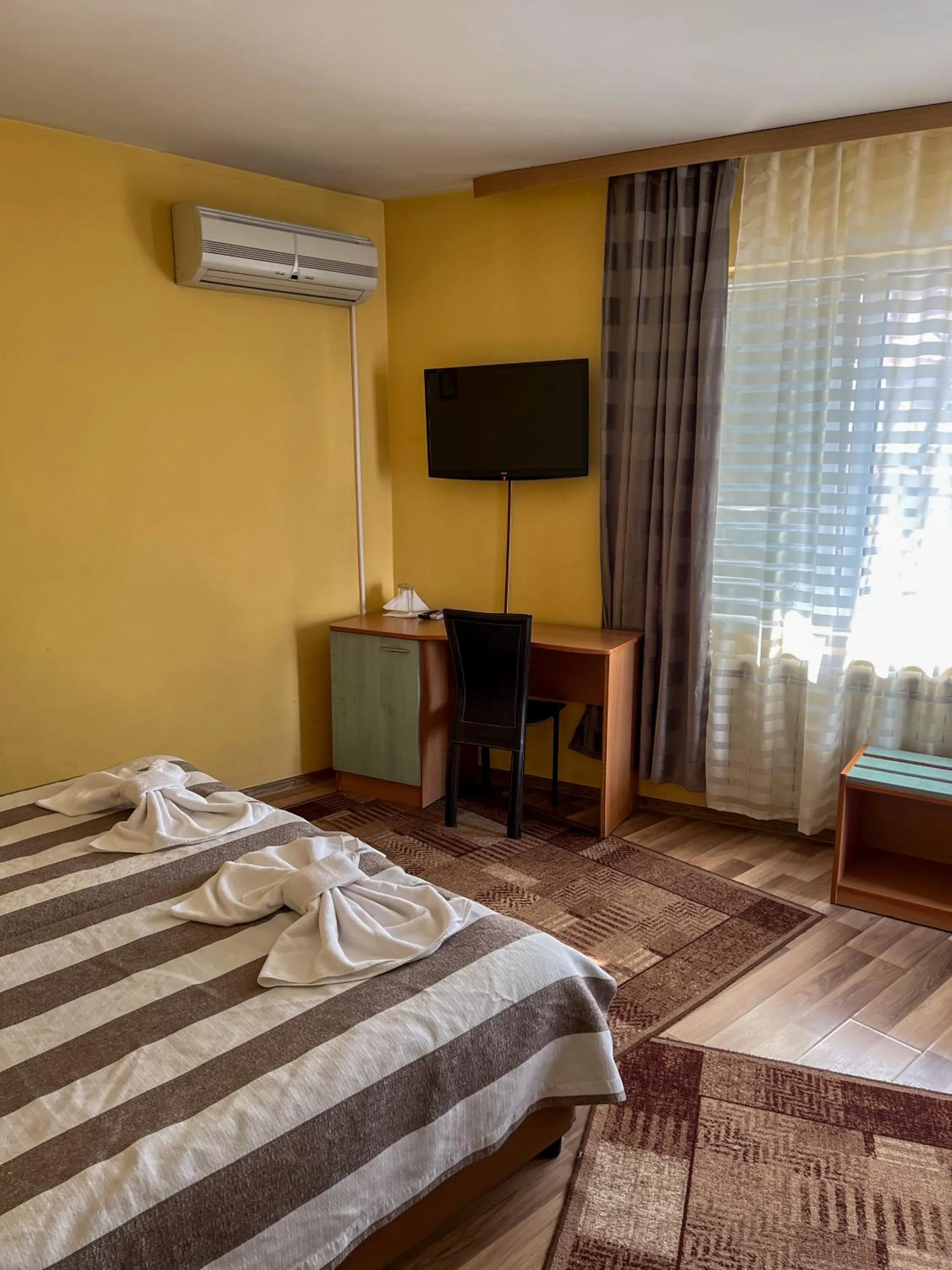 Bed in ALPHA family HOTEL