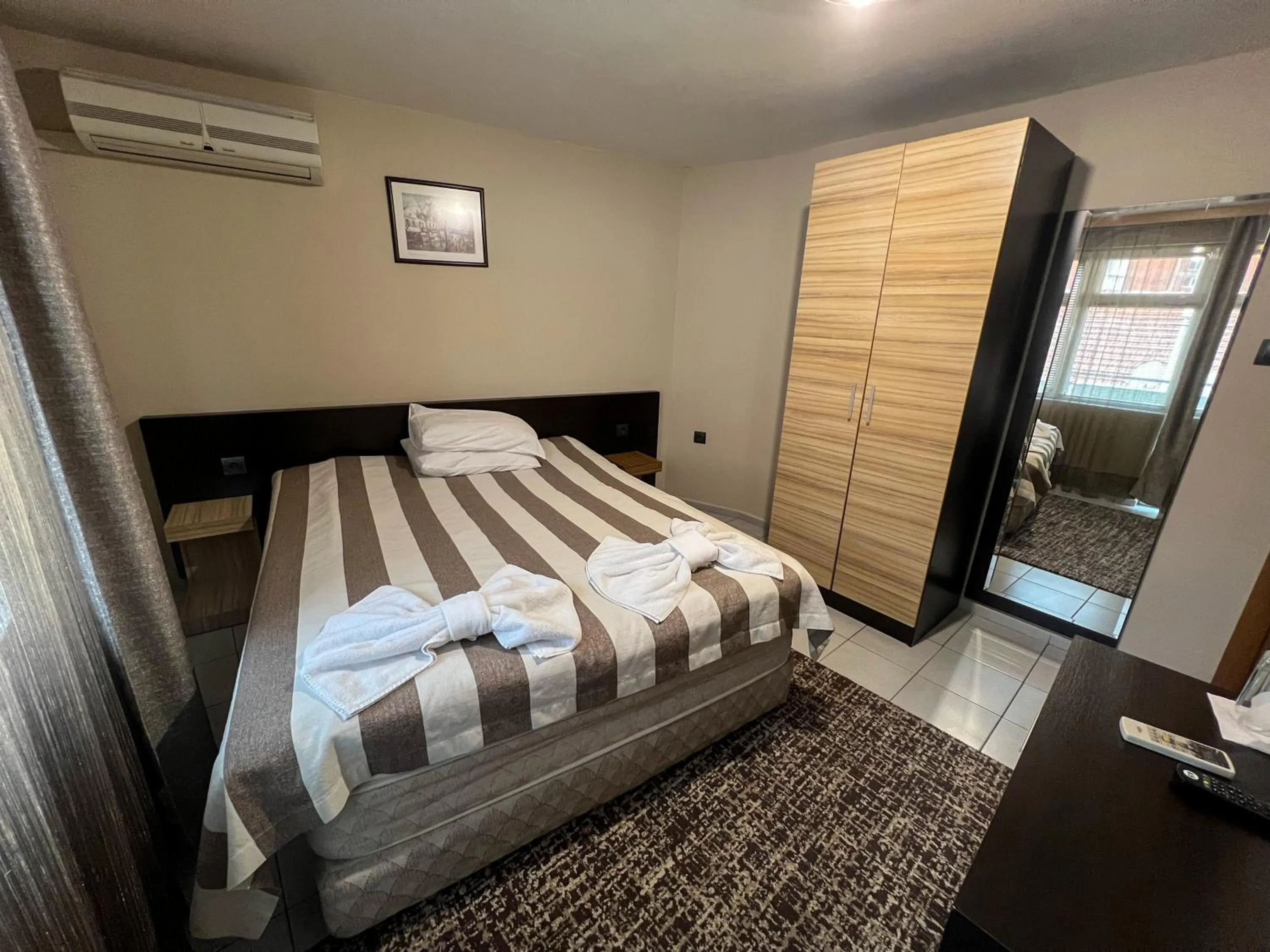 Bed in ALPHA family HOTEL