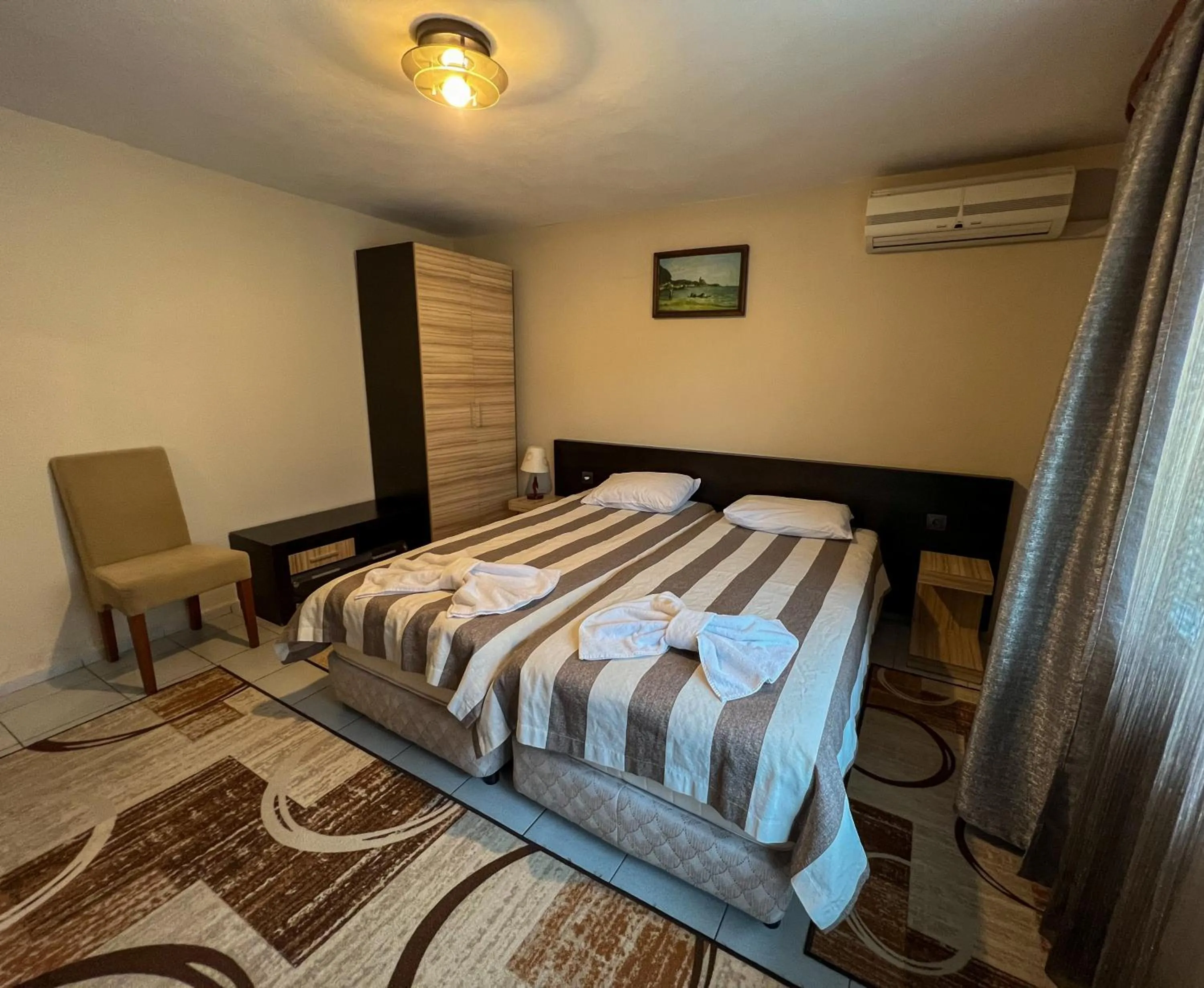 Bed in ALPHA family HOTEL