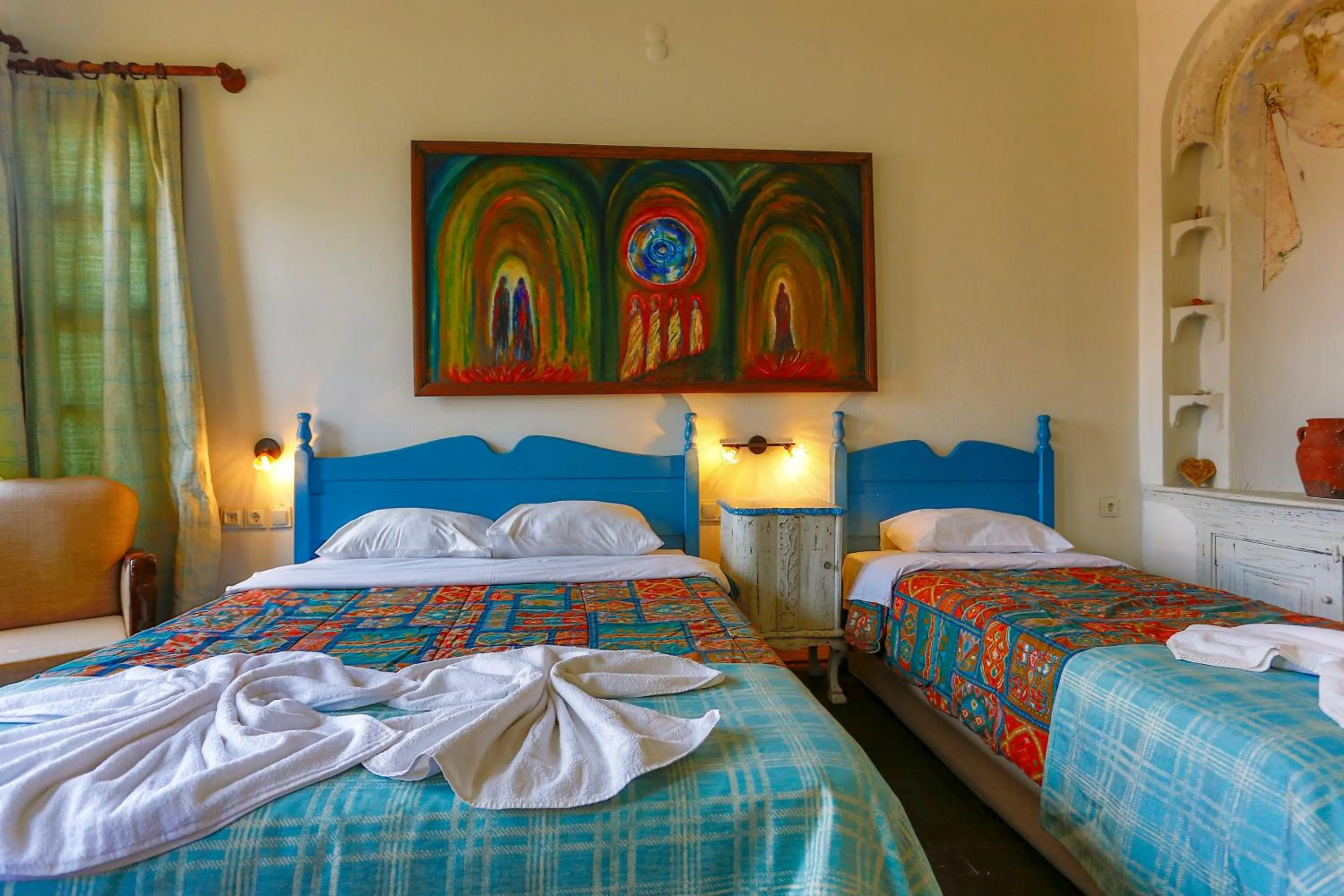 Bed in Atelya Art Hotel