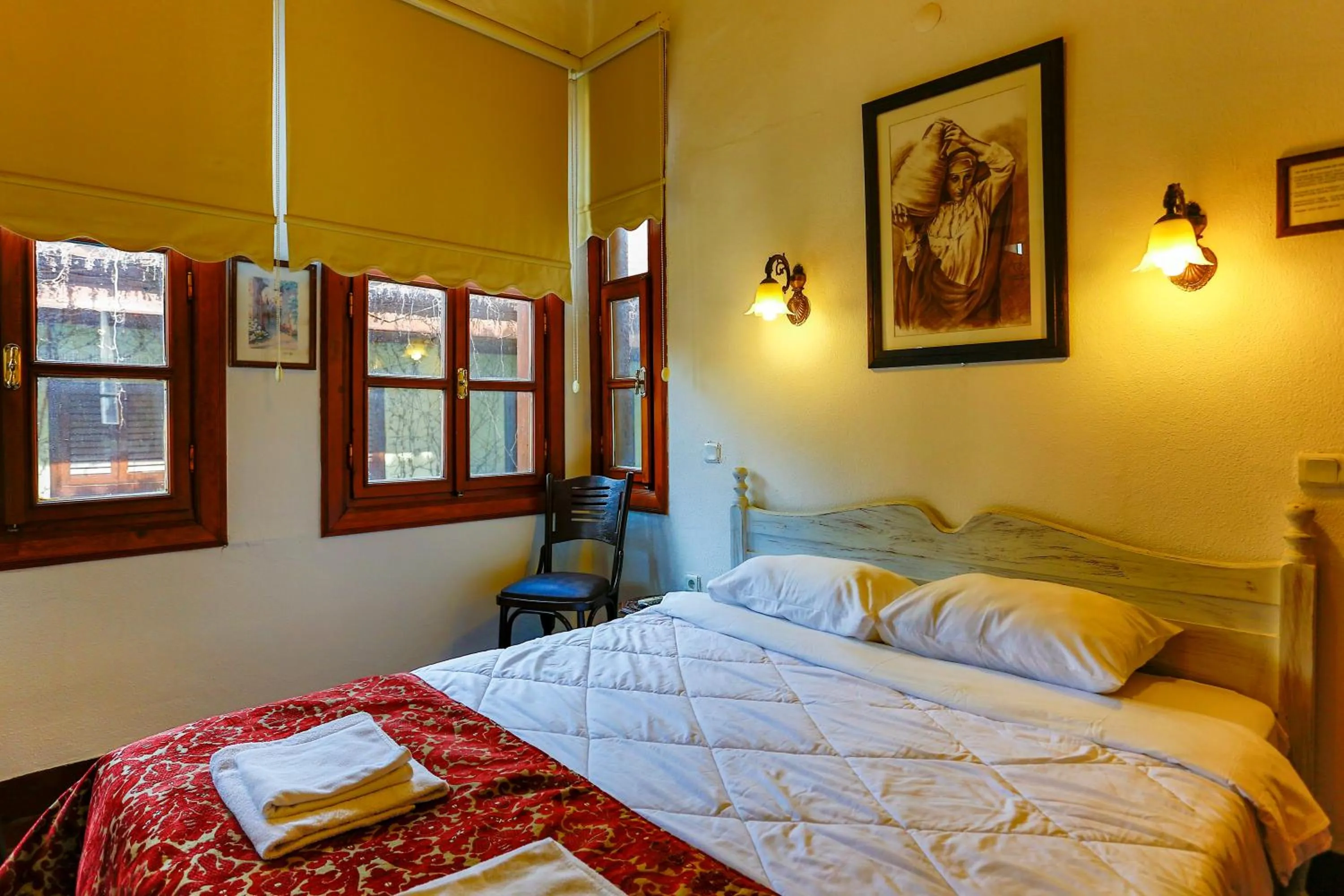 Bed in Atelya Art Hotel