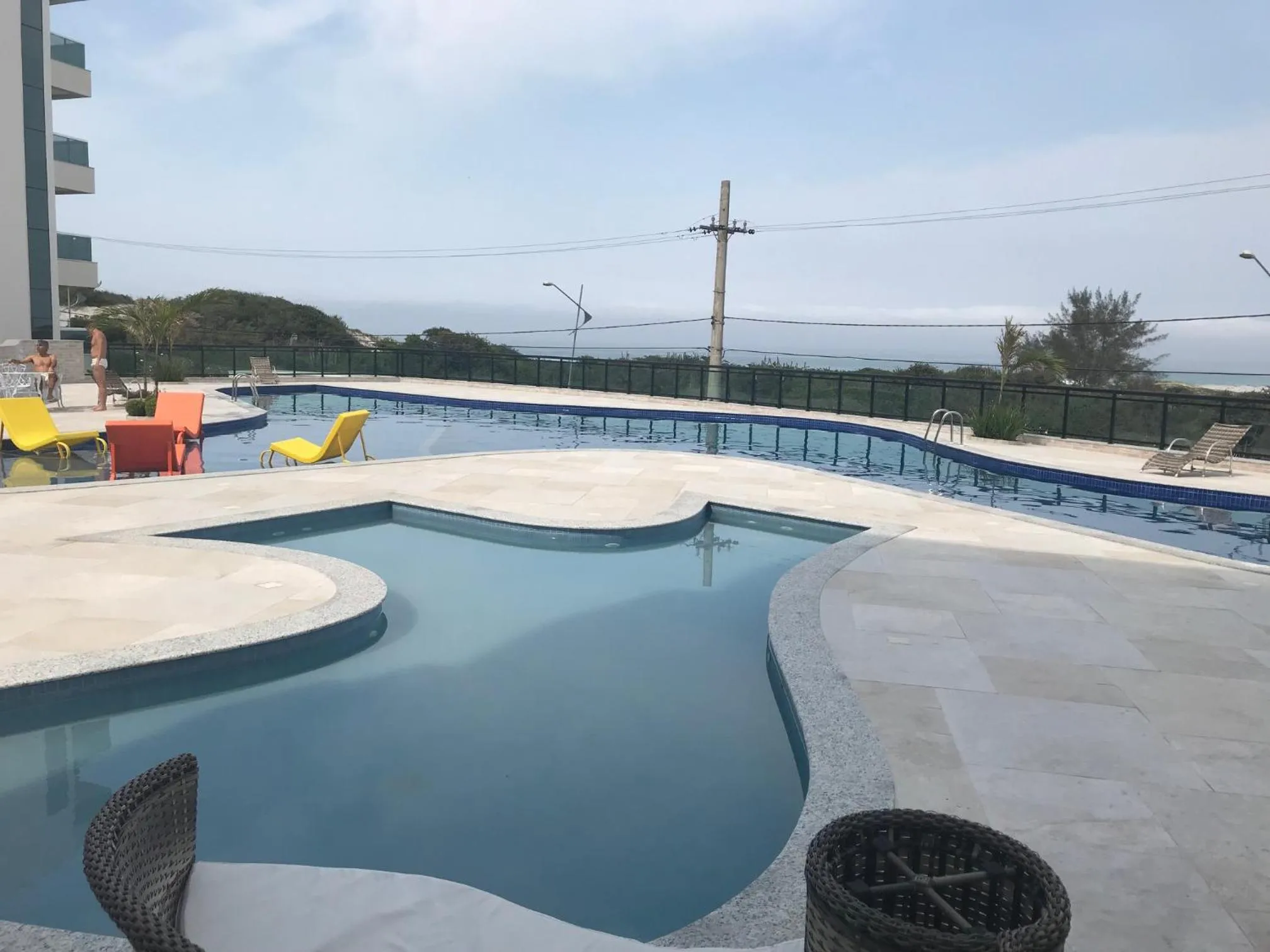Swimming pool in Apartamento Super Luxo em Arraial do Cabo