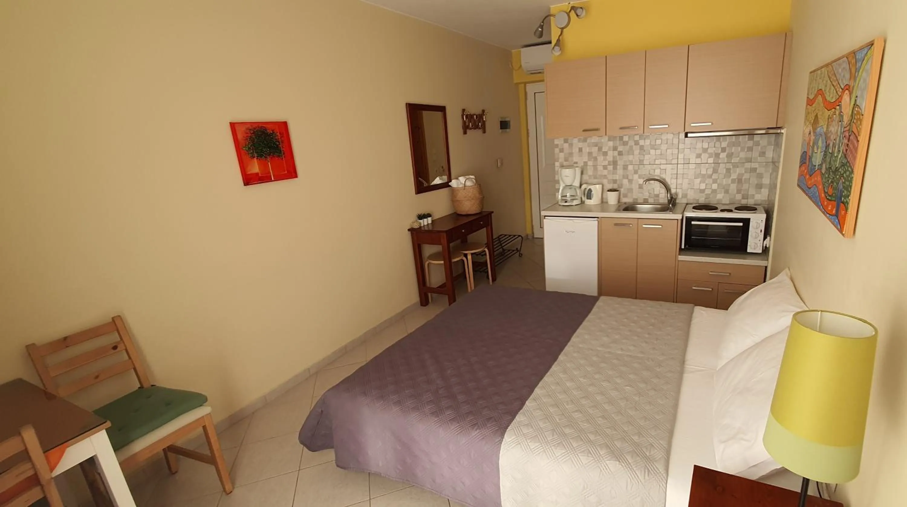 Photo of the whole room, Bed in Vasilis Studios