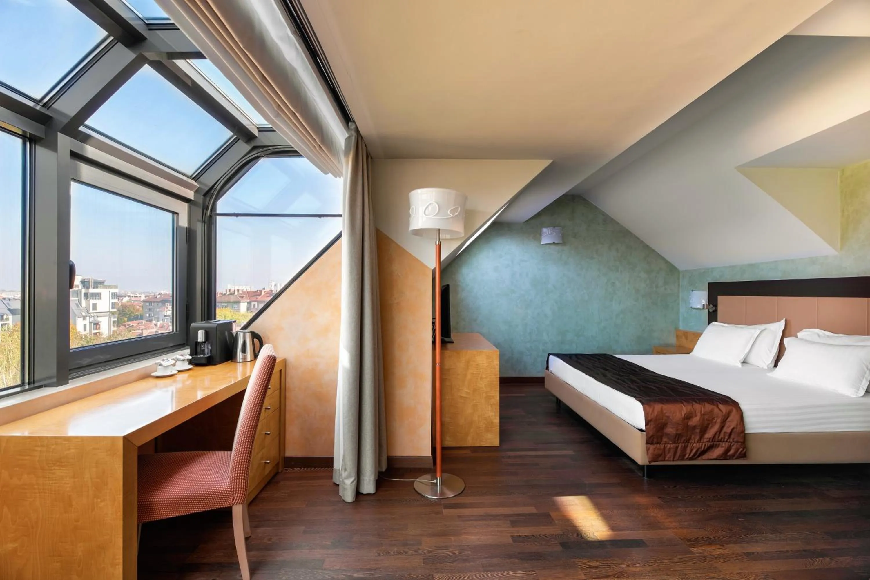 Living room, Bed in Eurostars Sofia City