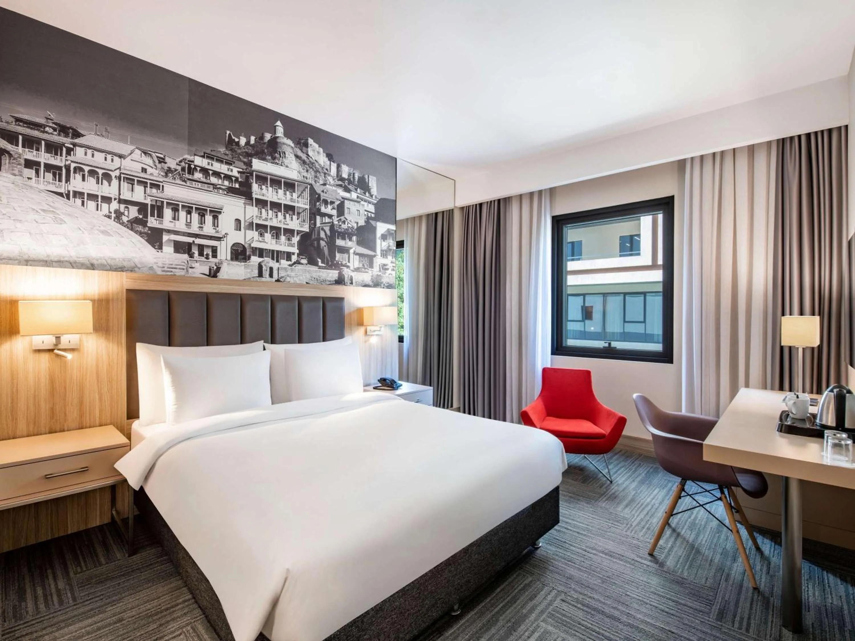 Bed in Ramada Encore Tbilisi