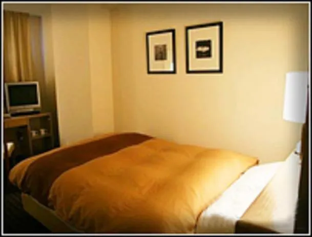 Bed in Hirosaki Plaza Hotel