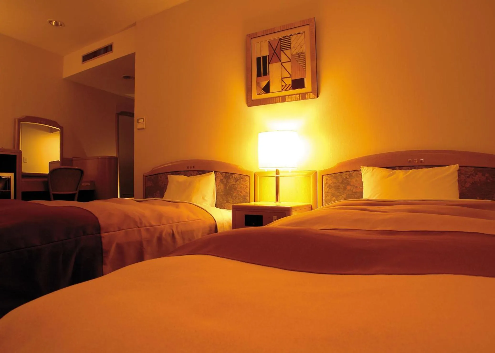 Bed in Hirosaki Plaza Hotel