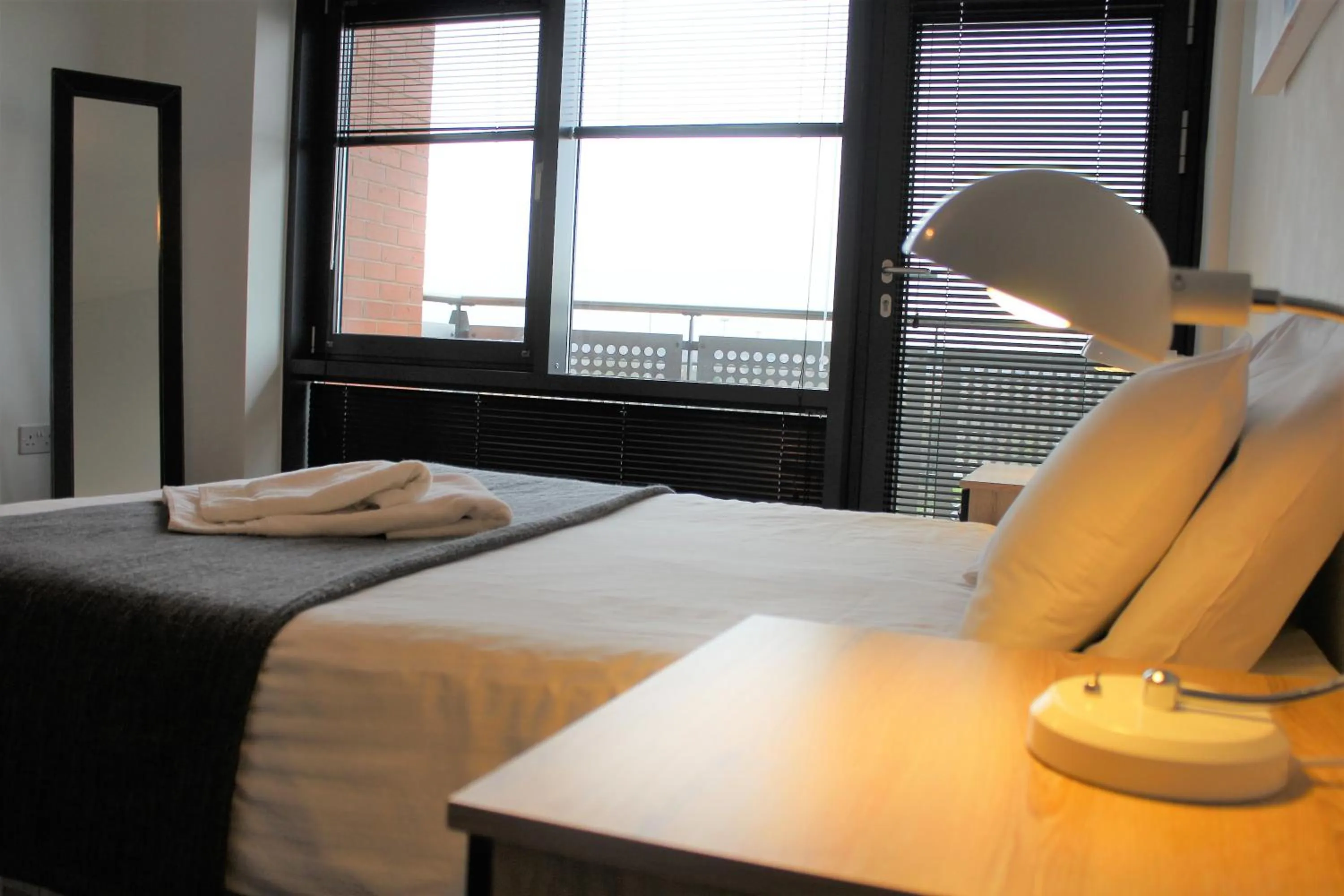 Bed in Empire Serviced Apartments