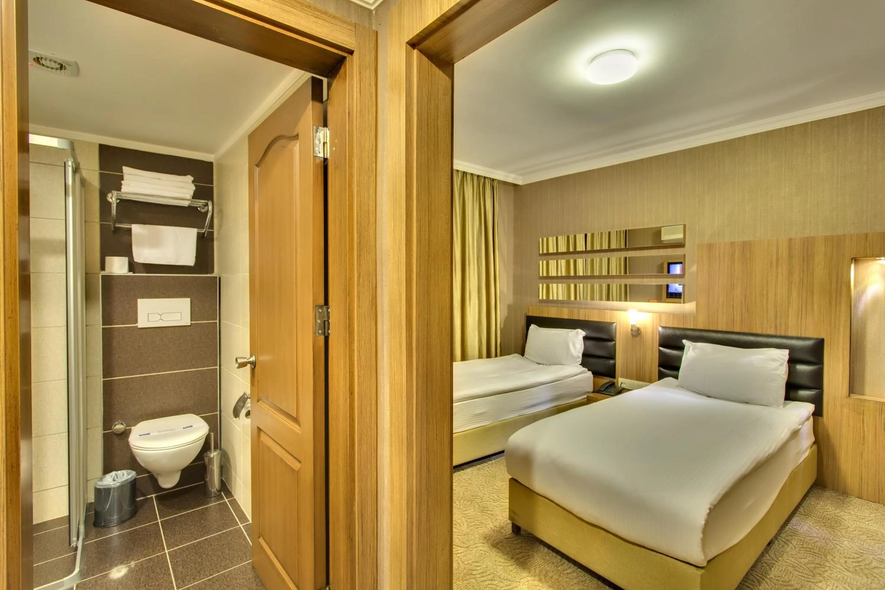 Bed in Antroyal Hotel