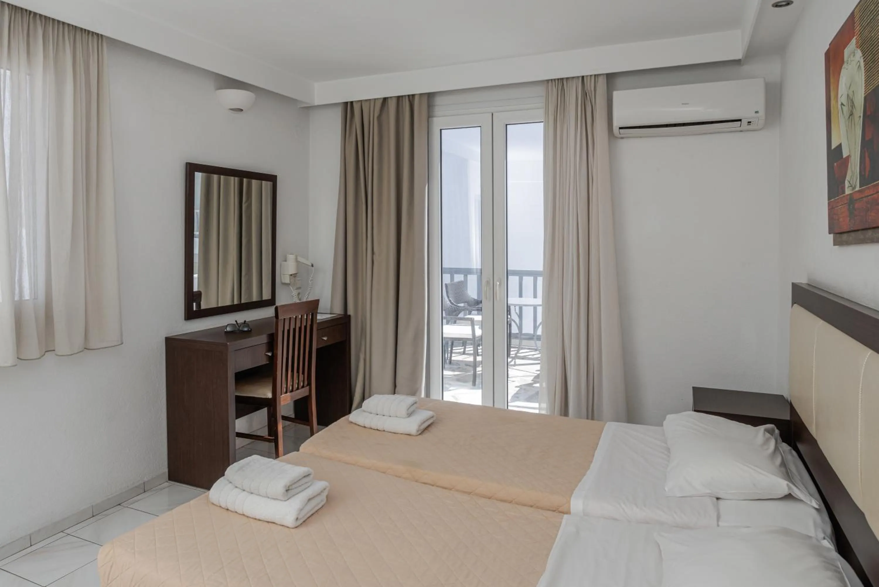 Bed in Elena Studios & Suites