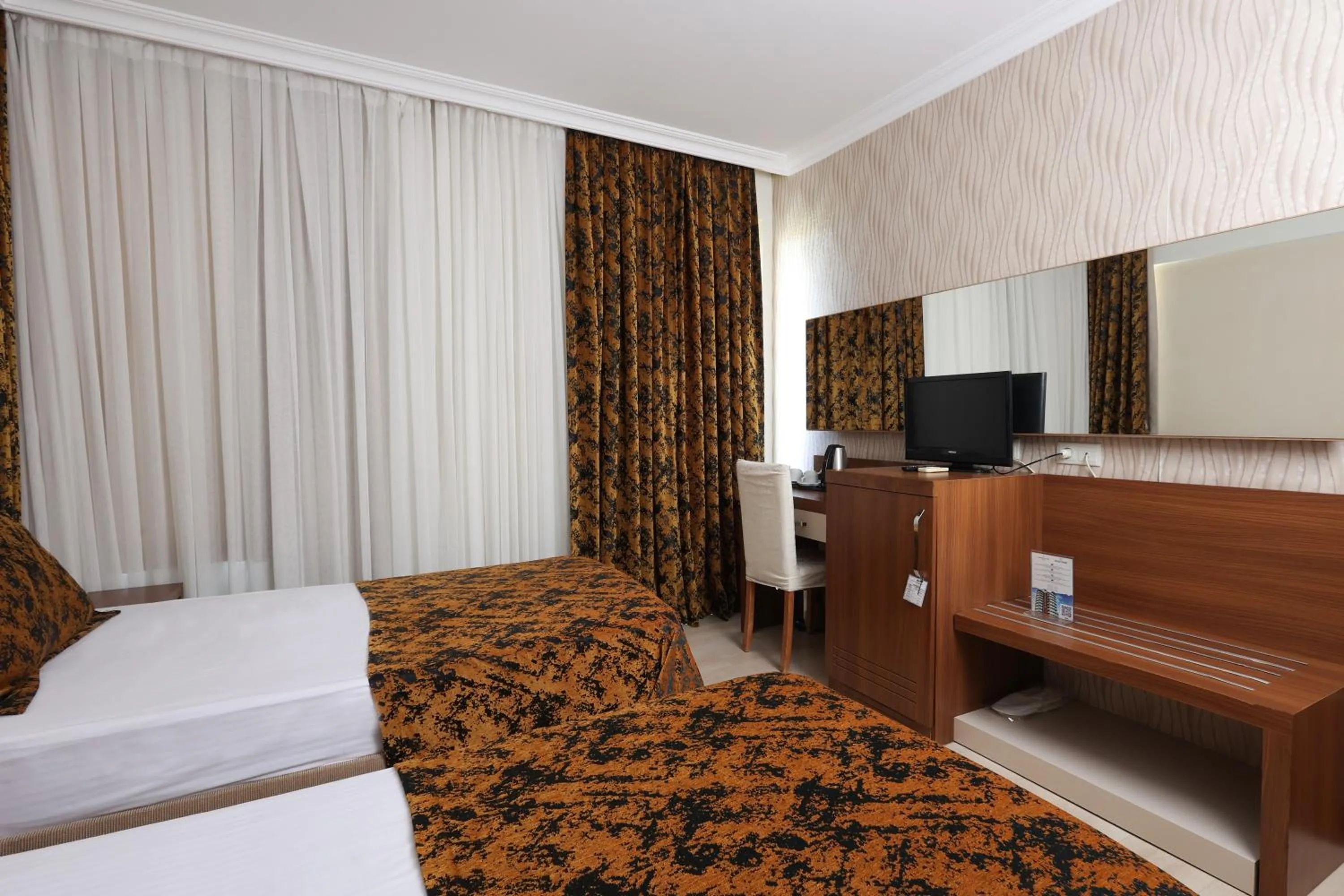 Bed in The Corner Park Hotel