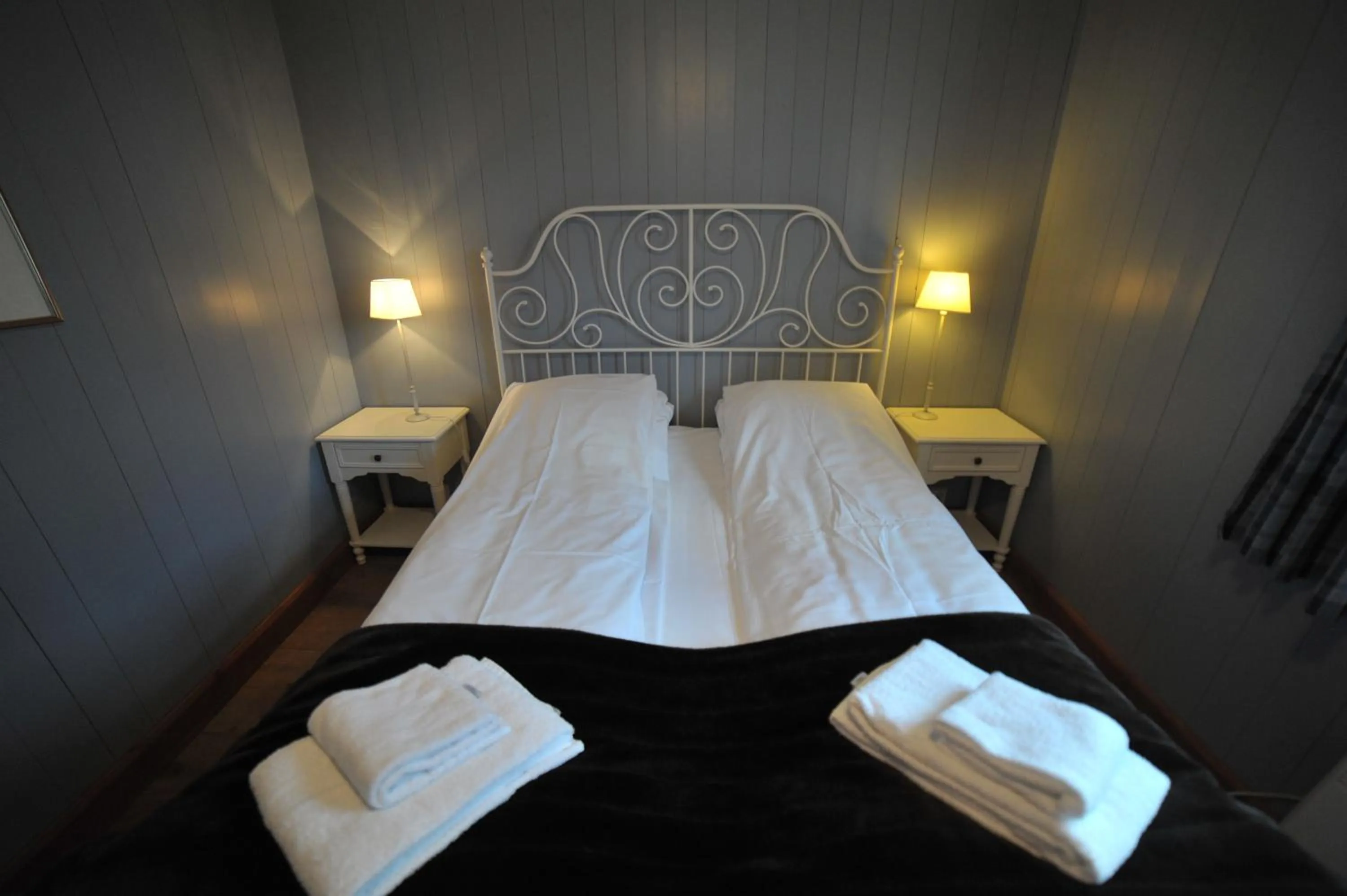 Bedroom, Bed in Reine Rorbuer - by Classic Norway Hotels