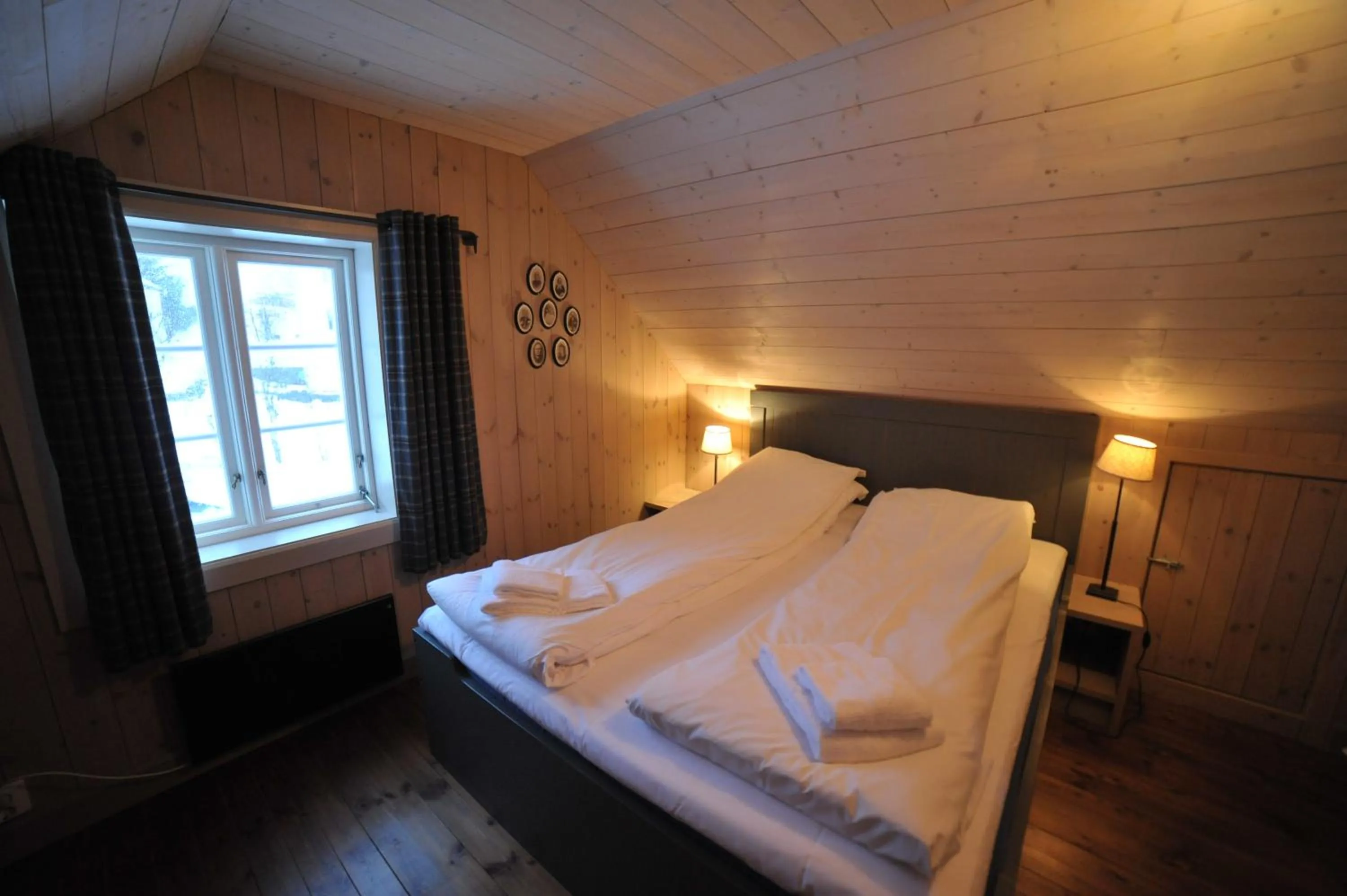 Bedroom, Bed in Reine Rorbuer - by Classic Norway Hotels