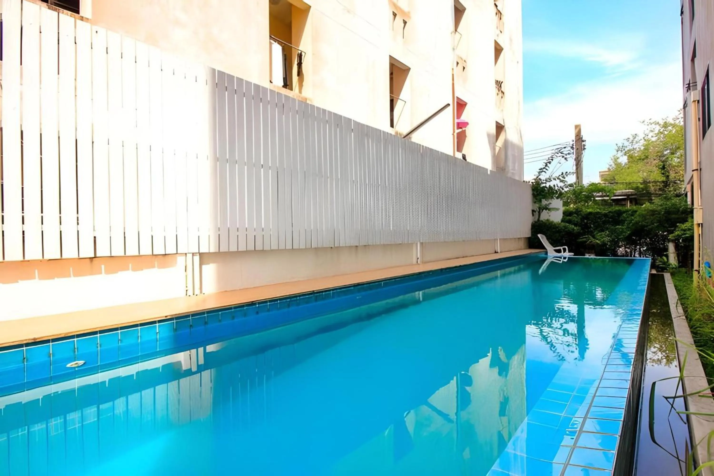 Swimming pool in Super OYO 427 Chill Apartment