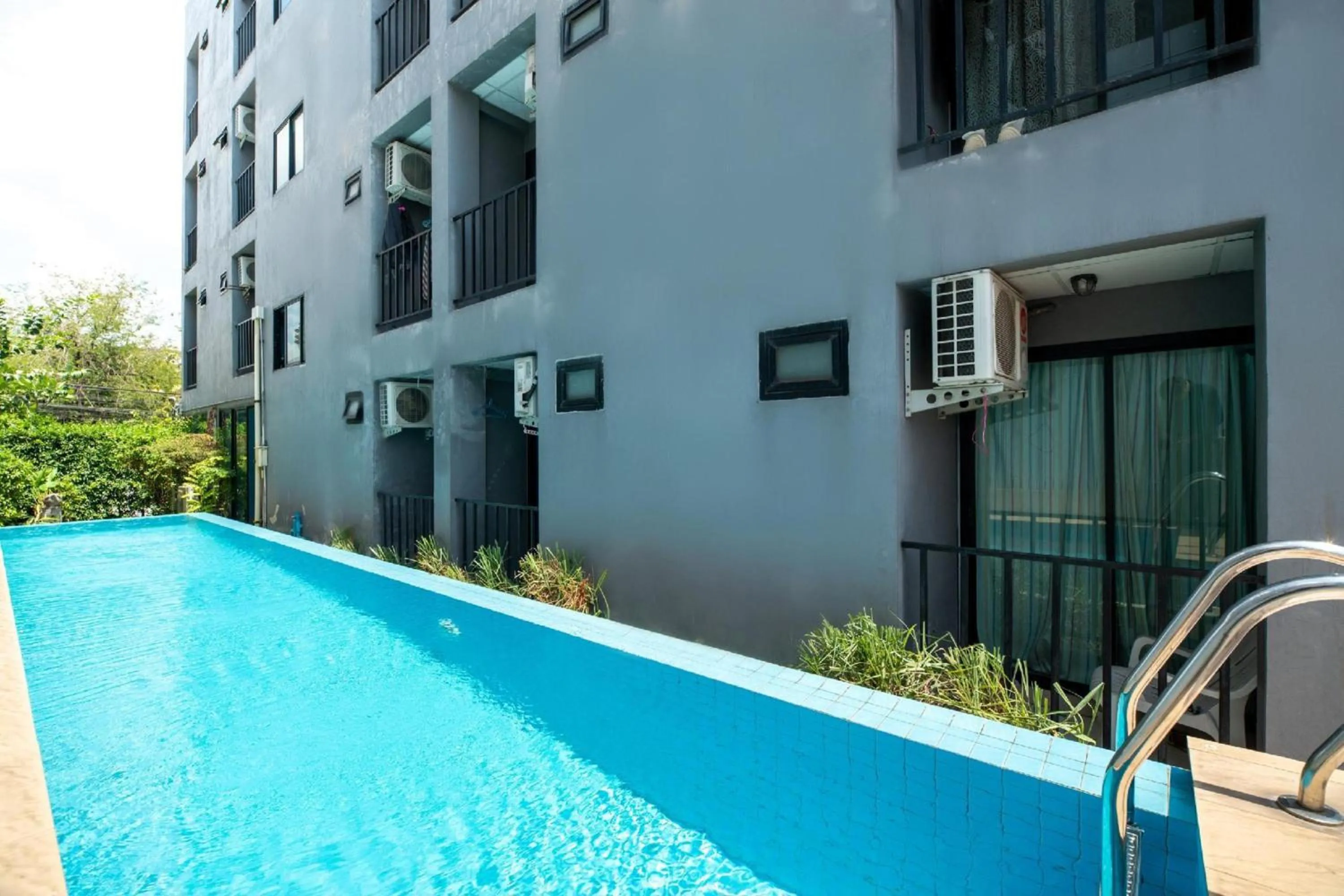 Swimming pool in Super OYO 427 Chill Apartment