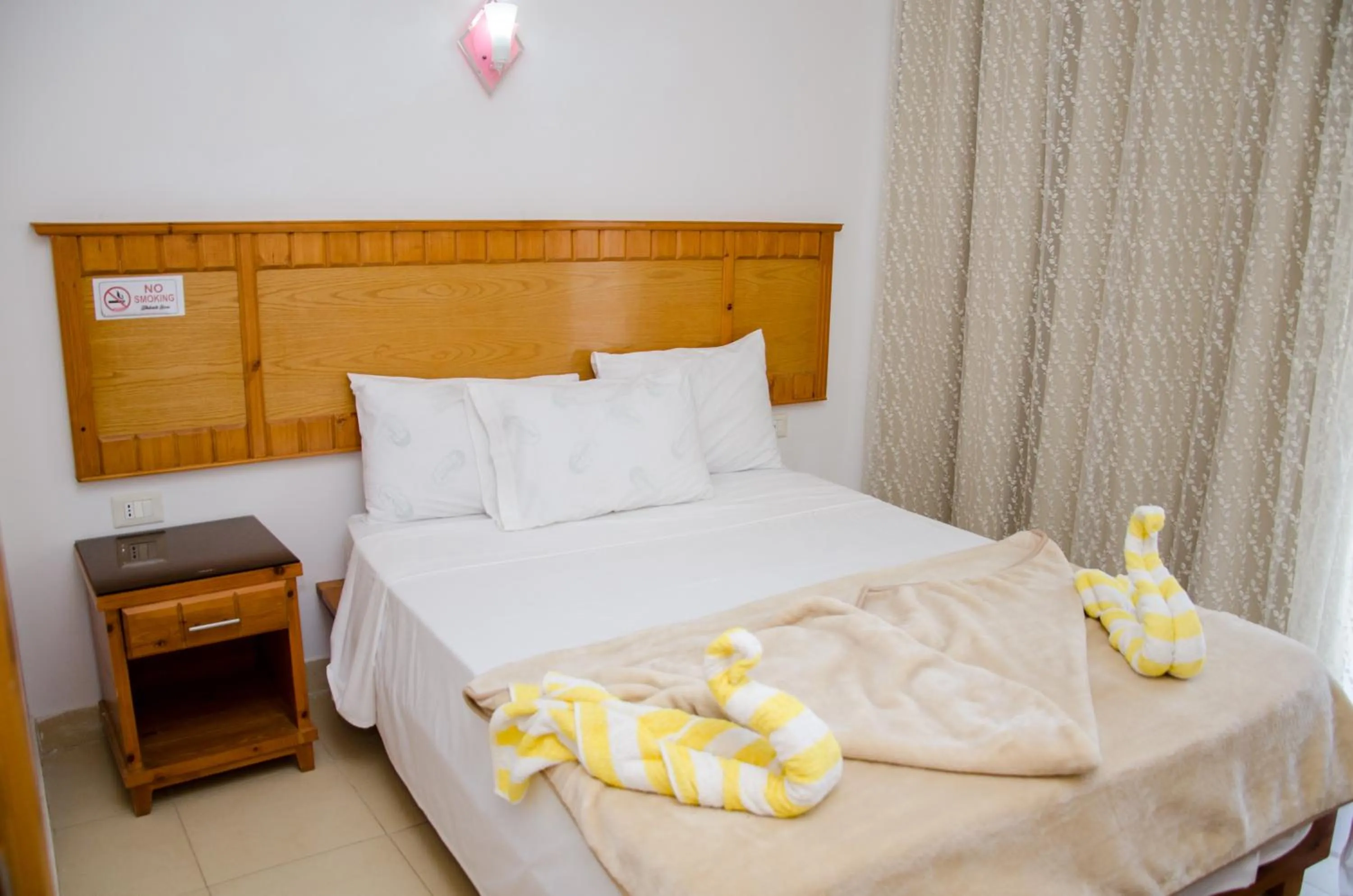 Bed in New Yalla Hotel