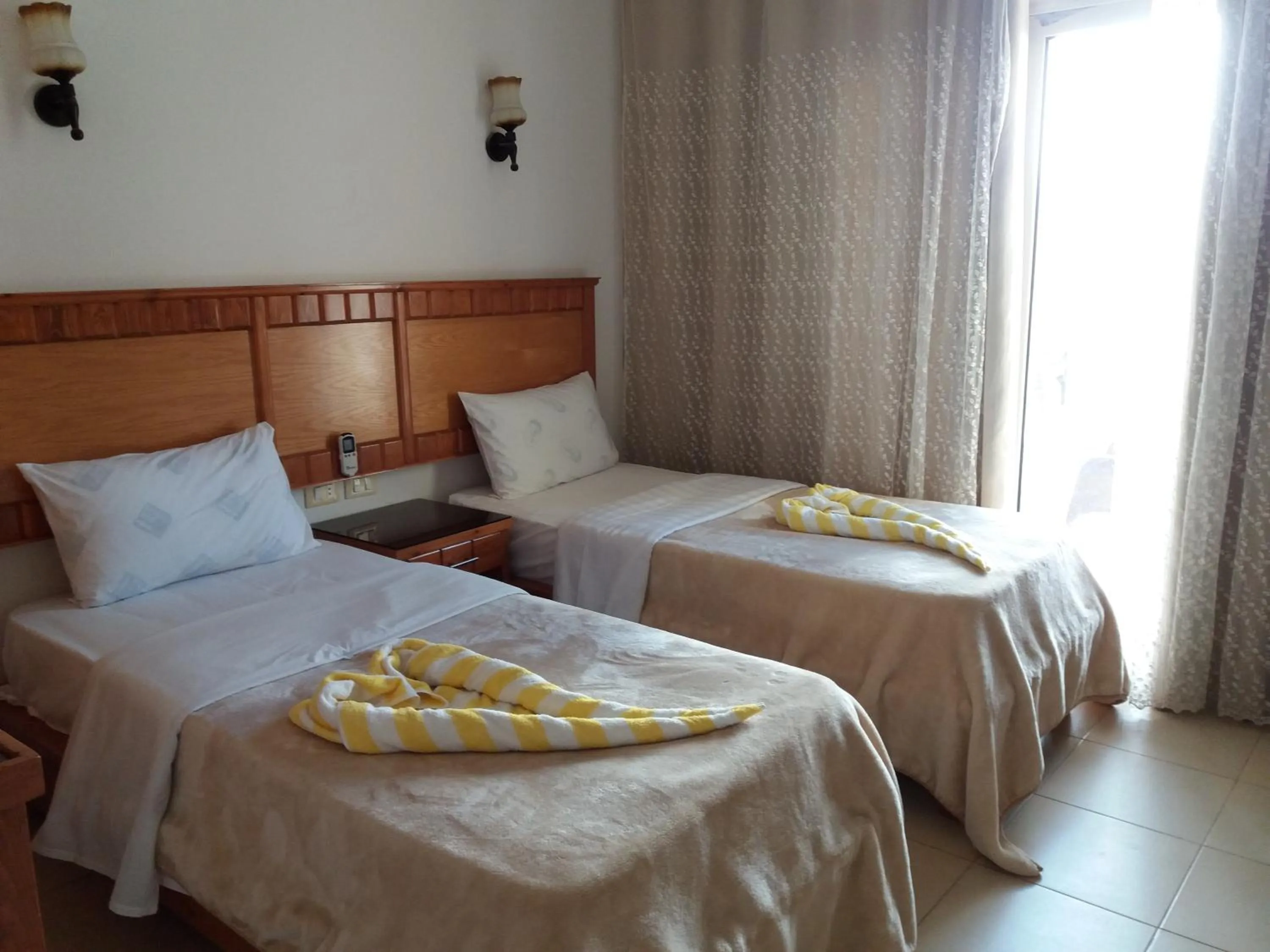 Photo of the whole room, Bed in New Yalla Hotel