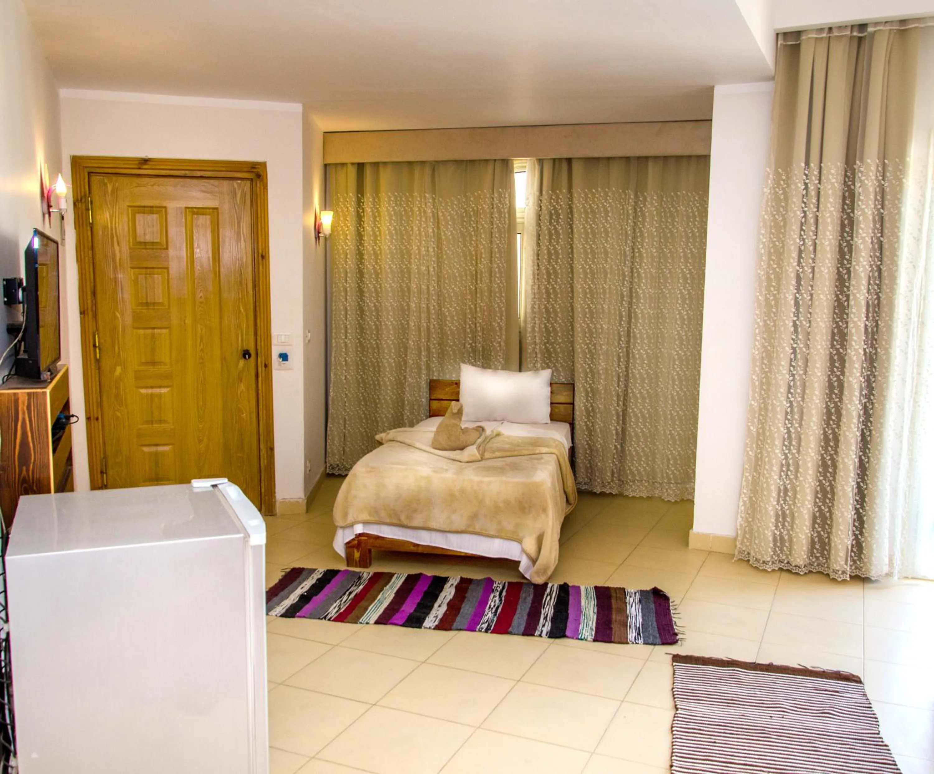 Bed in New Yalla Hotel