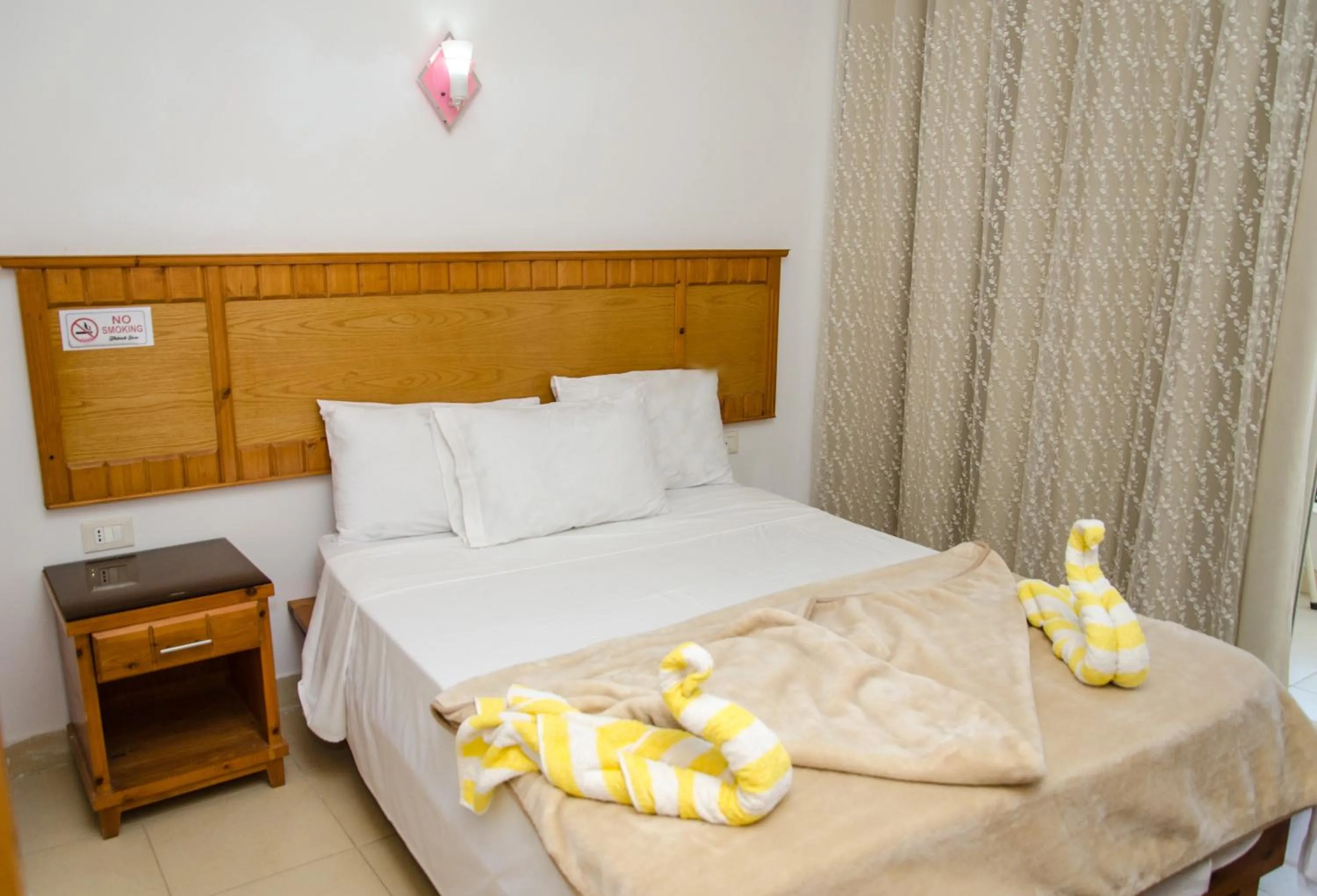 Bed in New Yalla Hotel