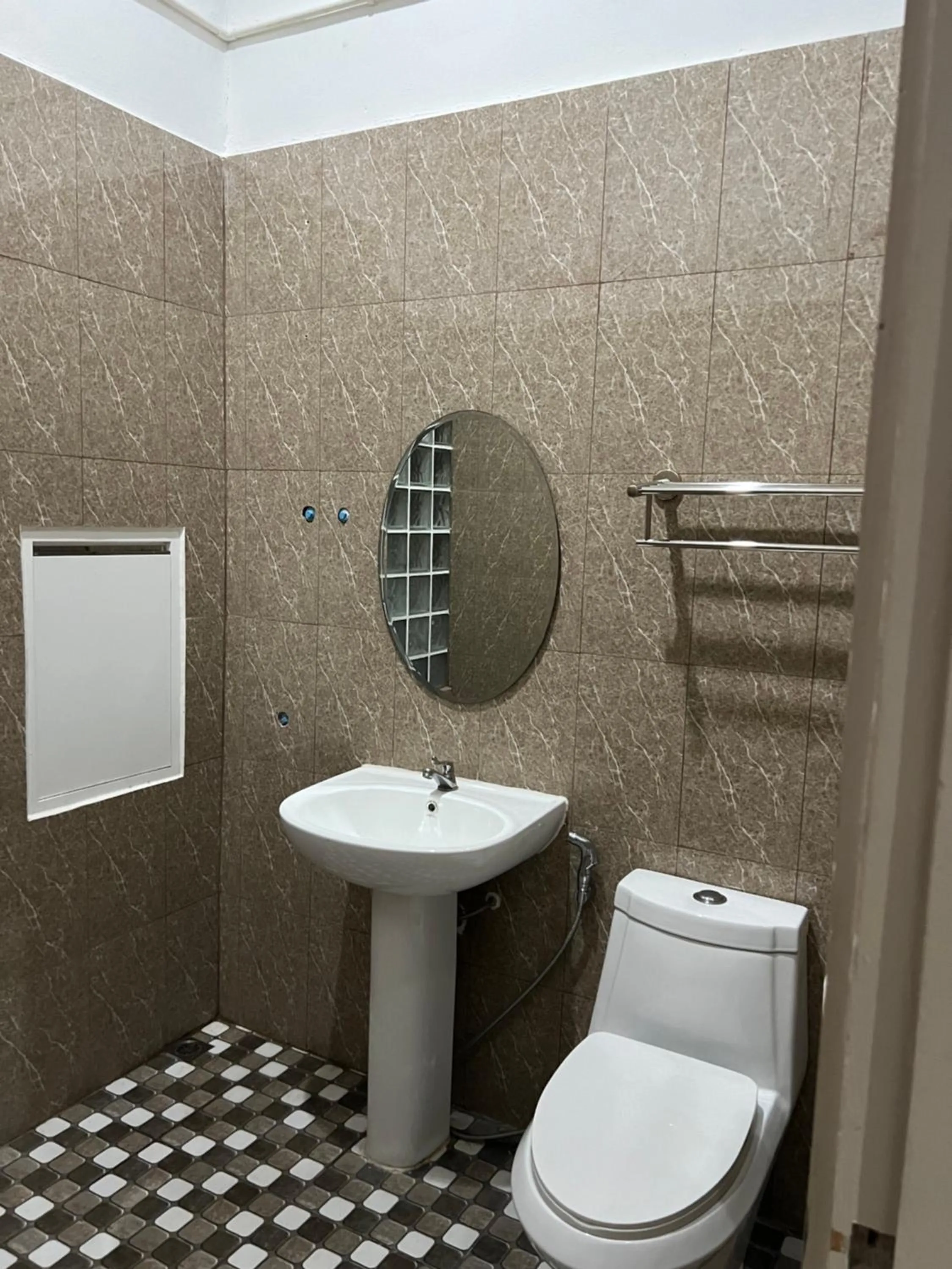 Toilet in Mall Suites Hotel