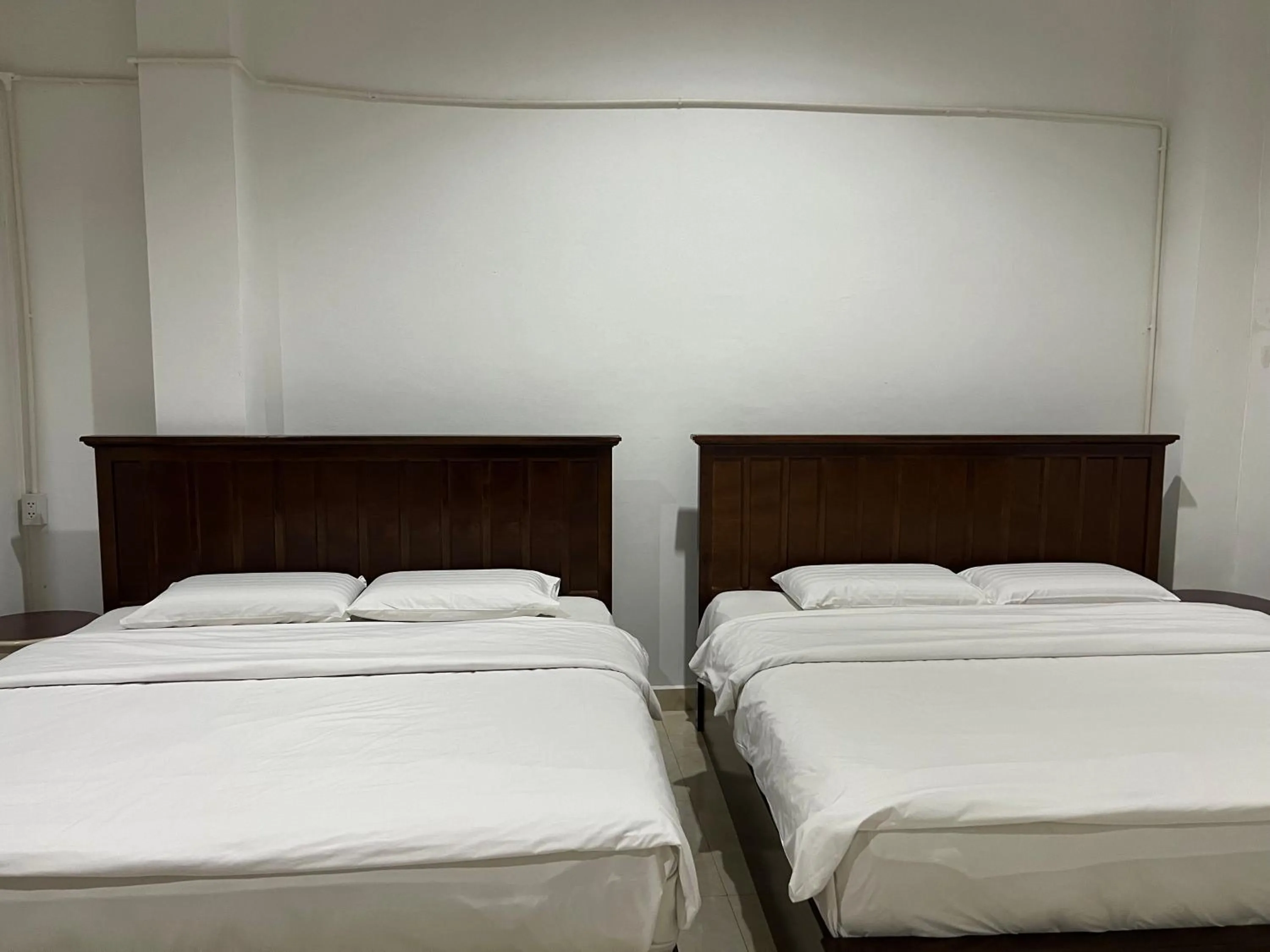 Bed in Mall Suites Hotel