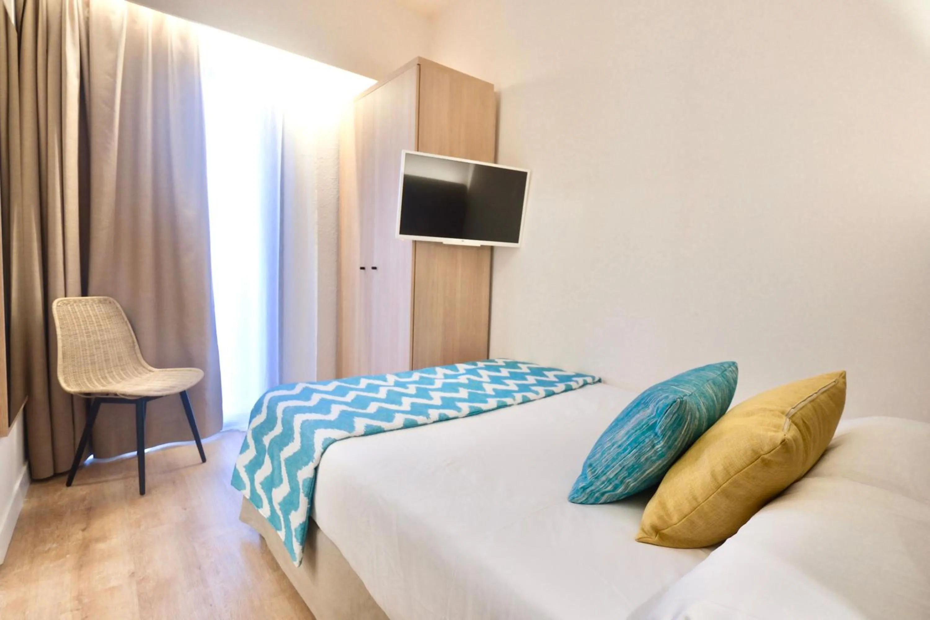 Bed in Cupido Boutique Hotel