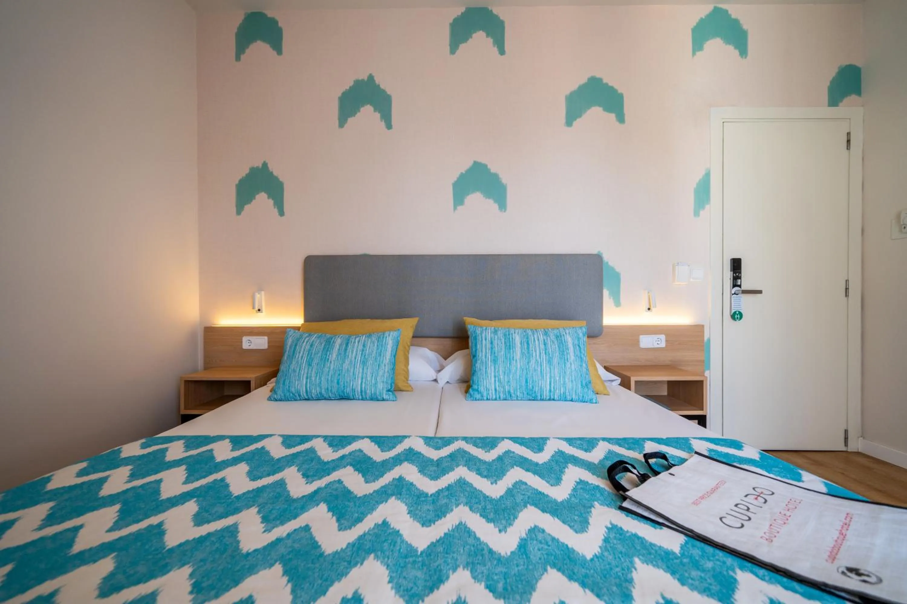 Bed in Cupido Boutique Hotel