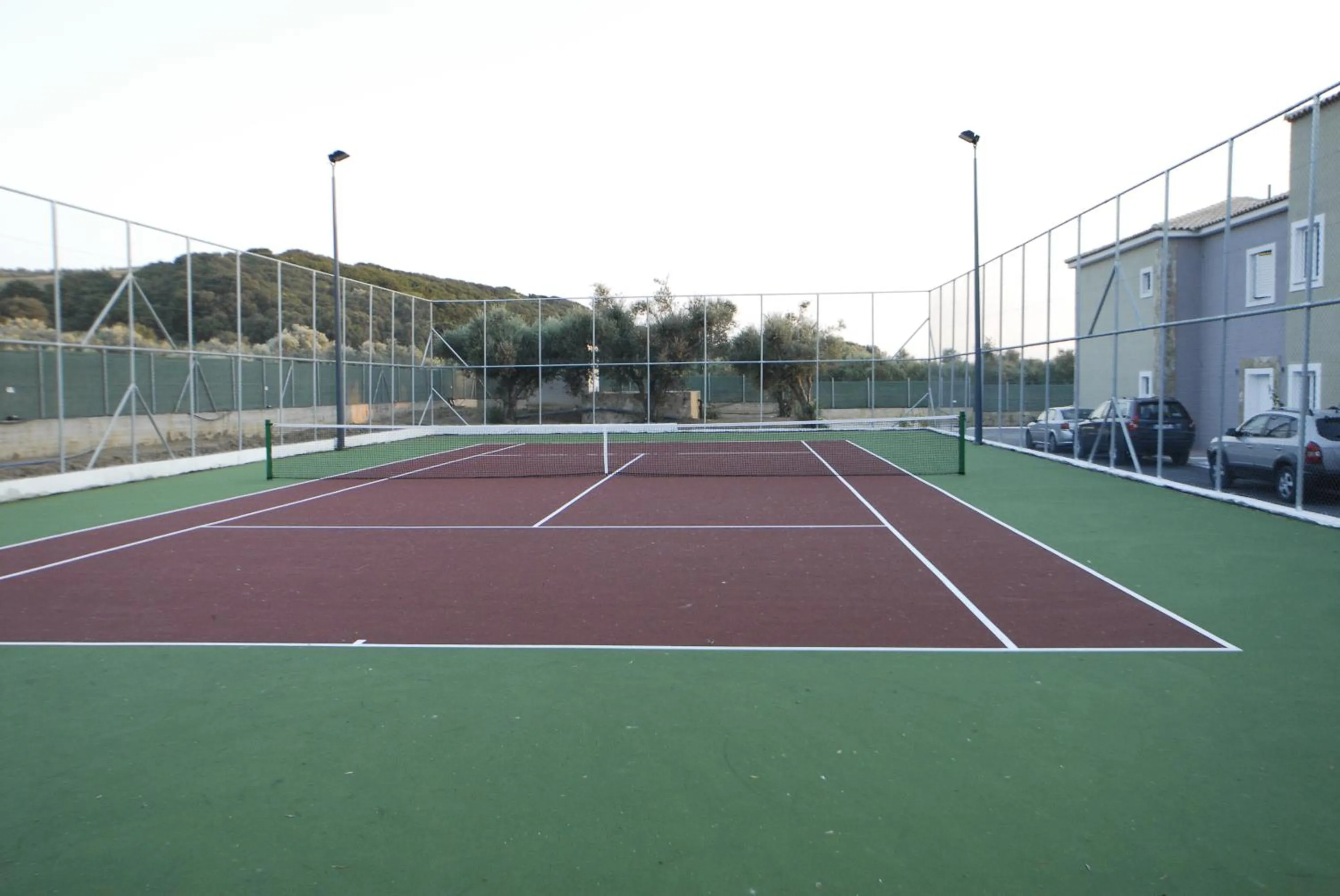 Tennis court in Olympia Golden Beach Resort & Spa