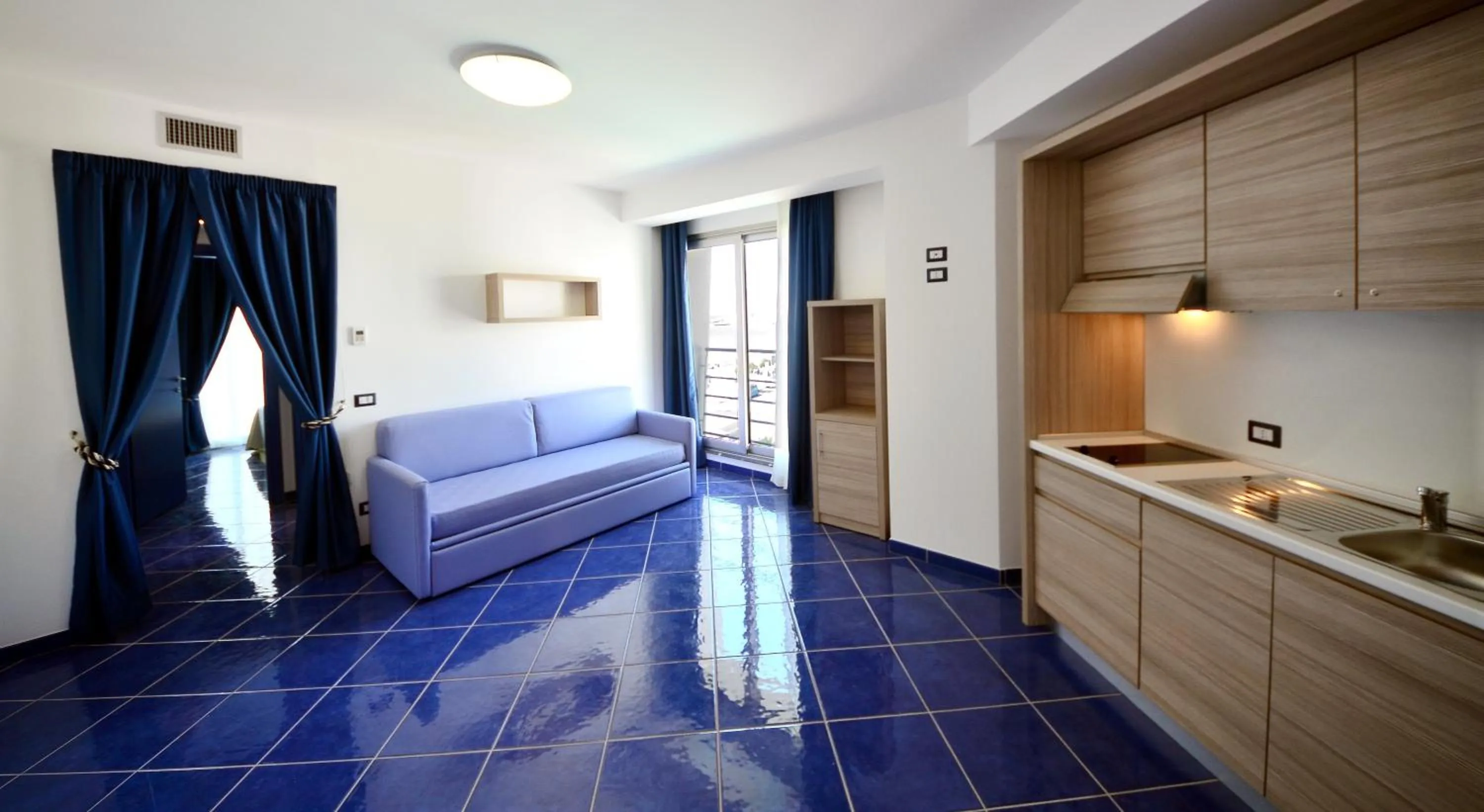 Living room, Bed in Astro Suite Hotel