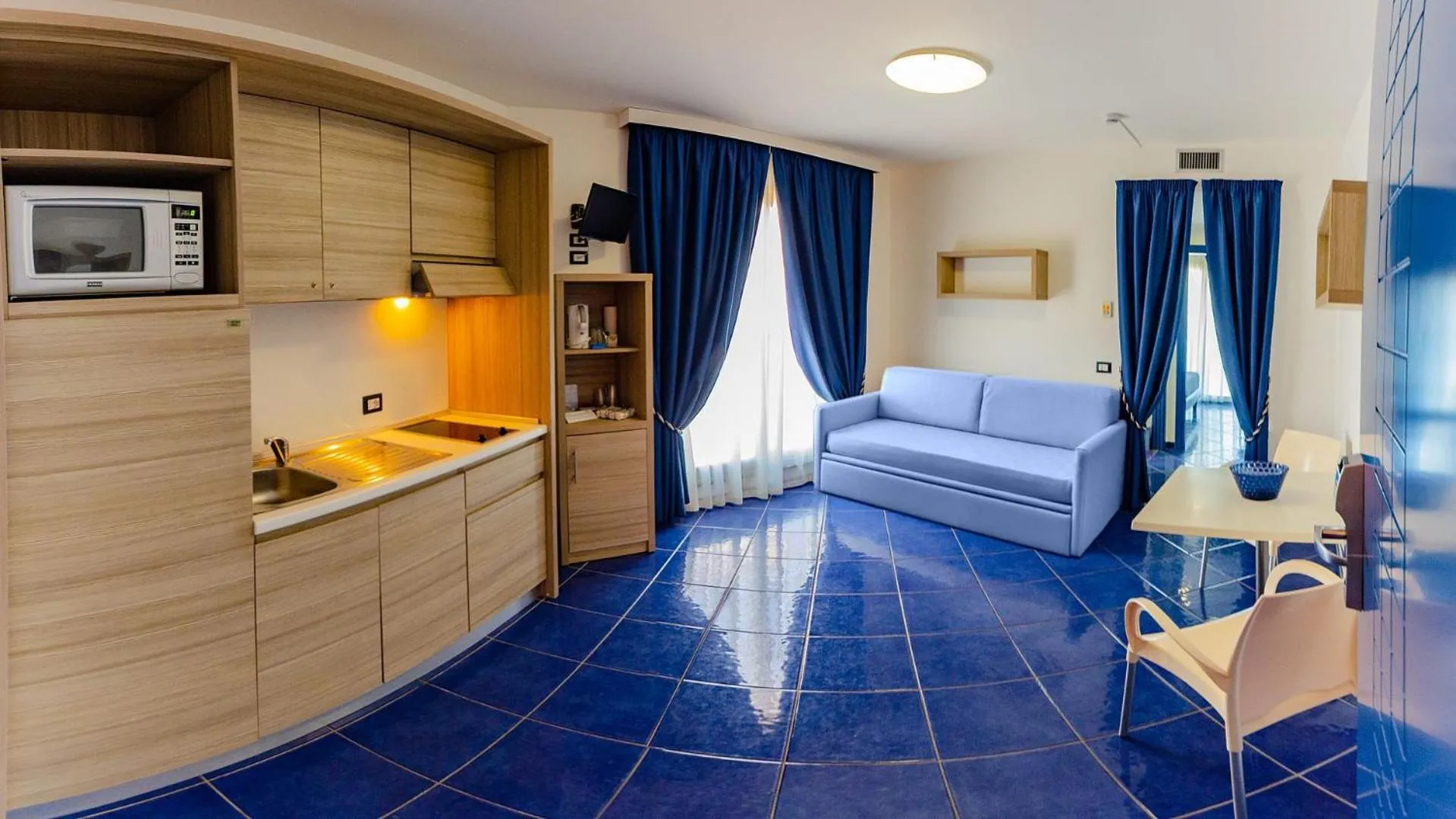 Kitchen or kitchenette in Astro Suite Hotel