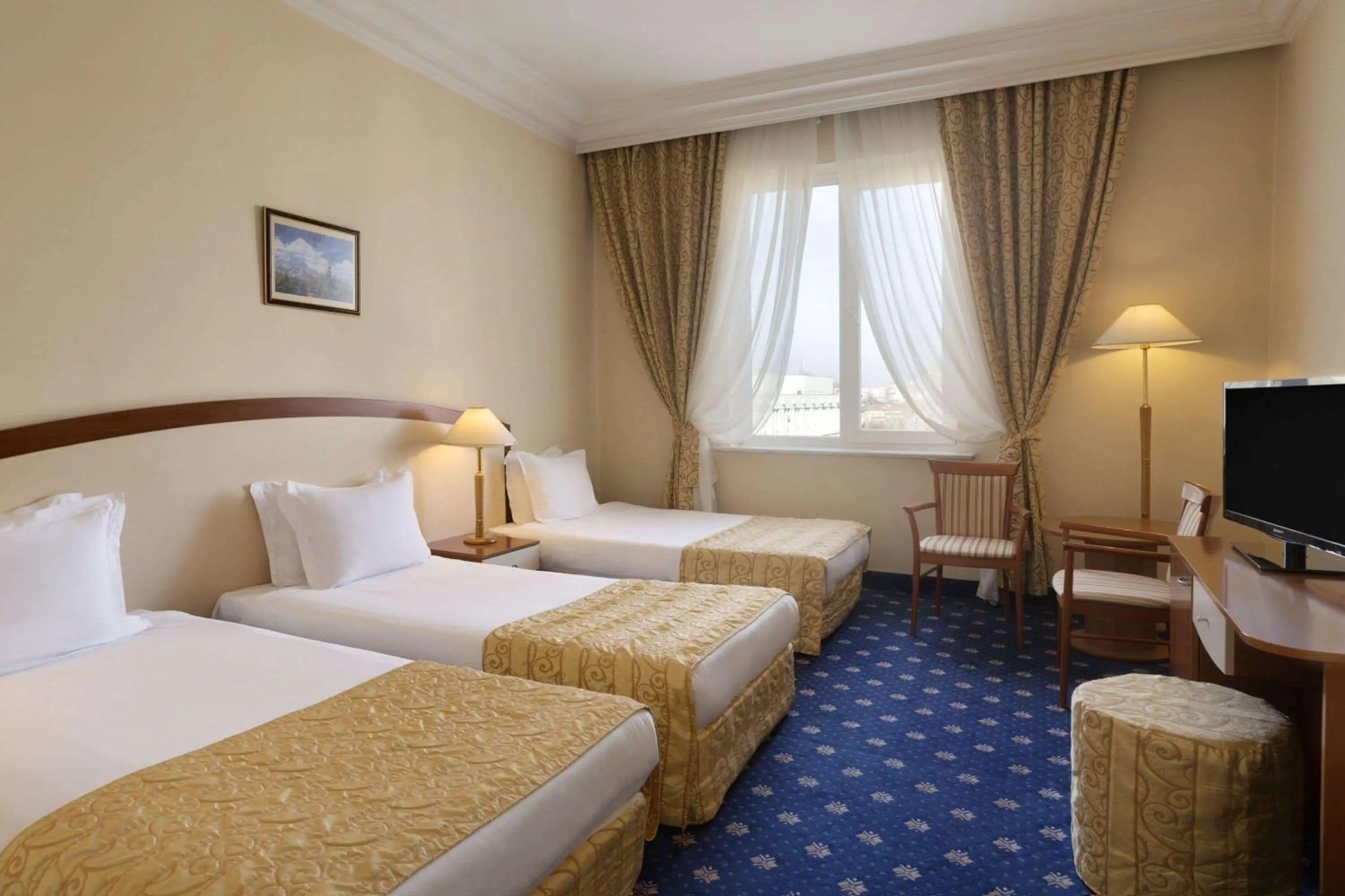 Photo of the whole room, Bed in Ramada by Wyndham Plovdiv Trimontium