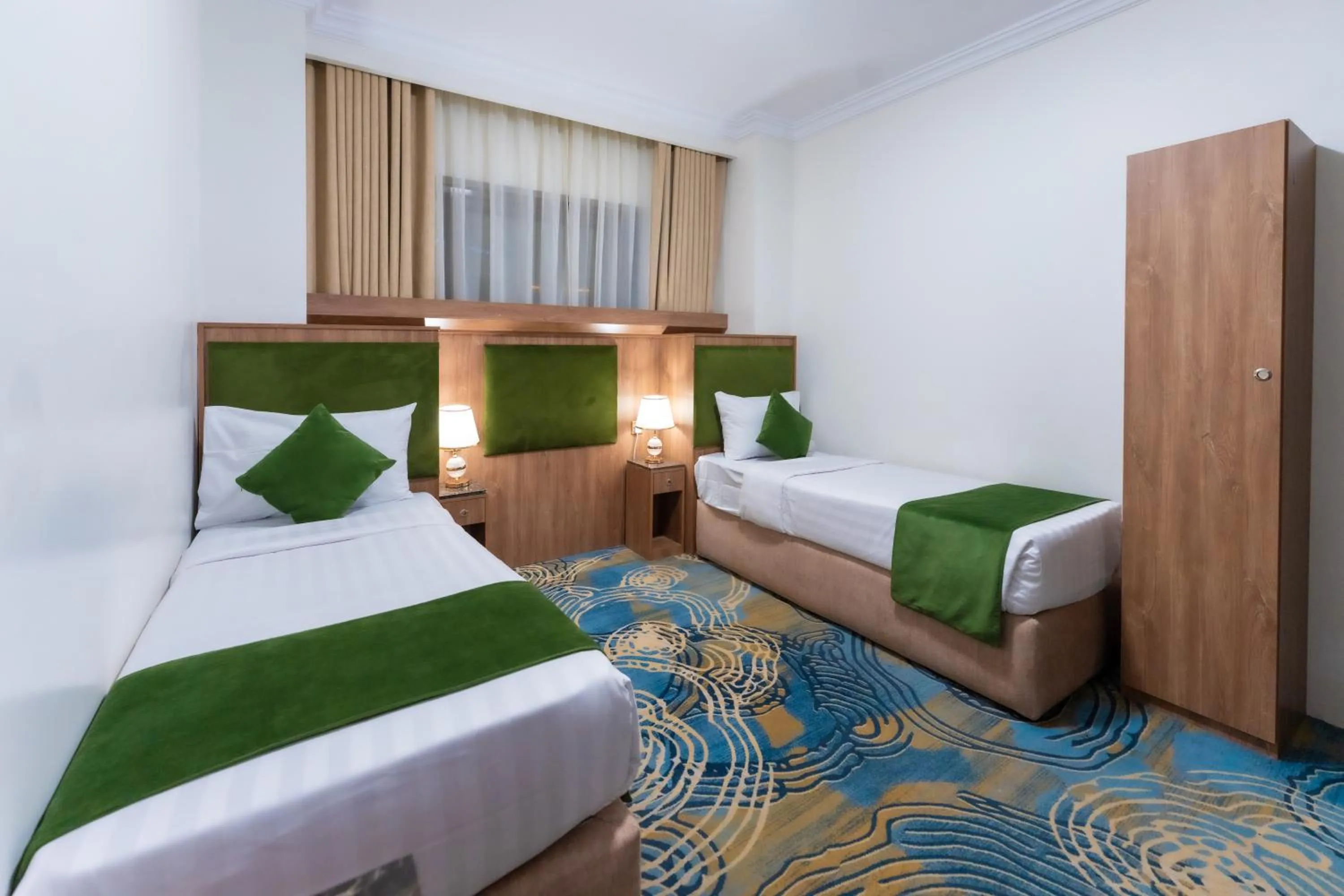 Bed in Hayah Plaza Hotel