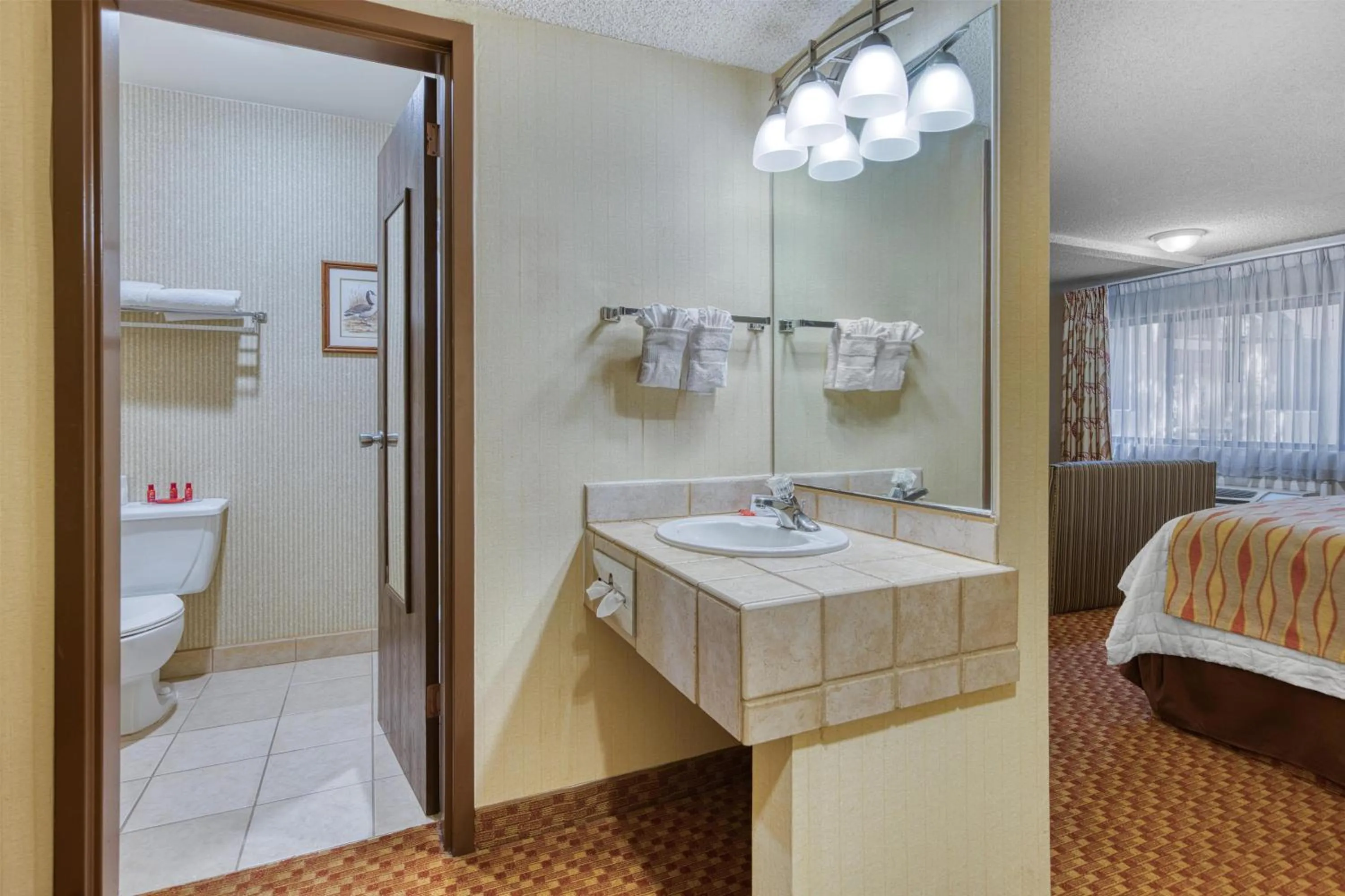 Bathroom, Bed in SureStay Plus Hotel by Best Western Reno Airport